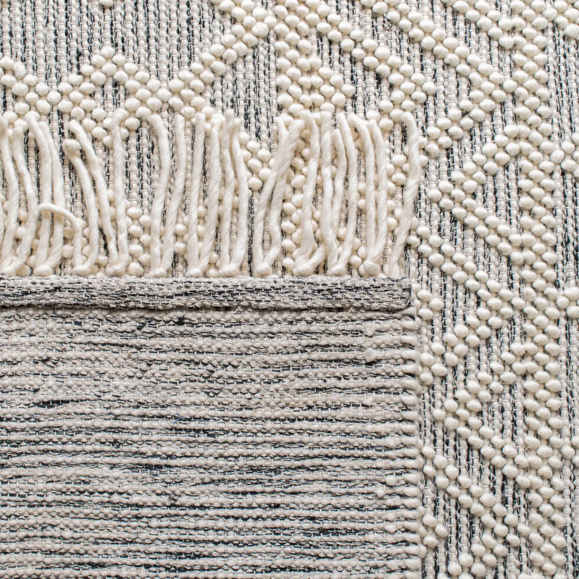 Natura Chevron And Diamond Hand-Loomed Rug in Ivory / Black in a styled room