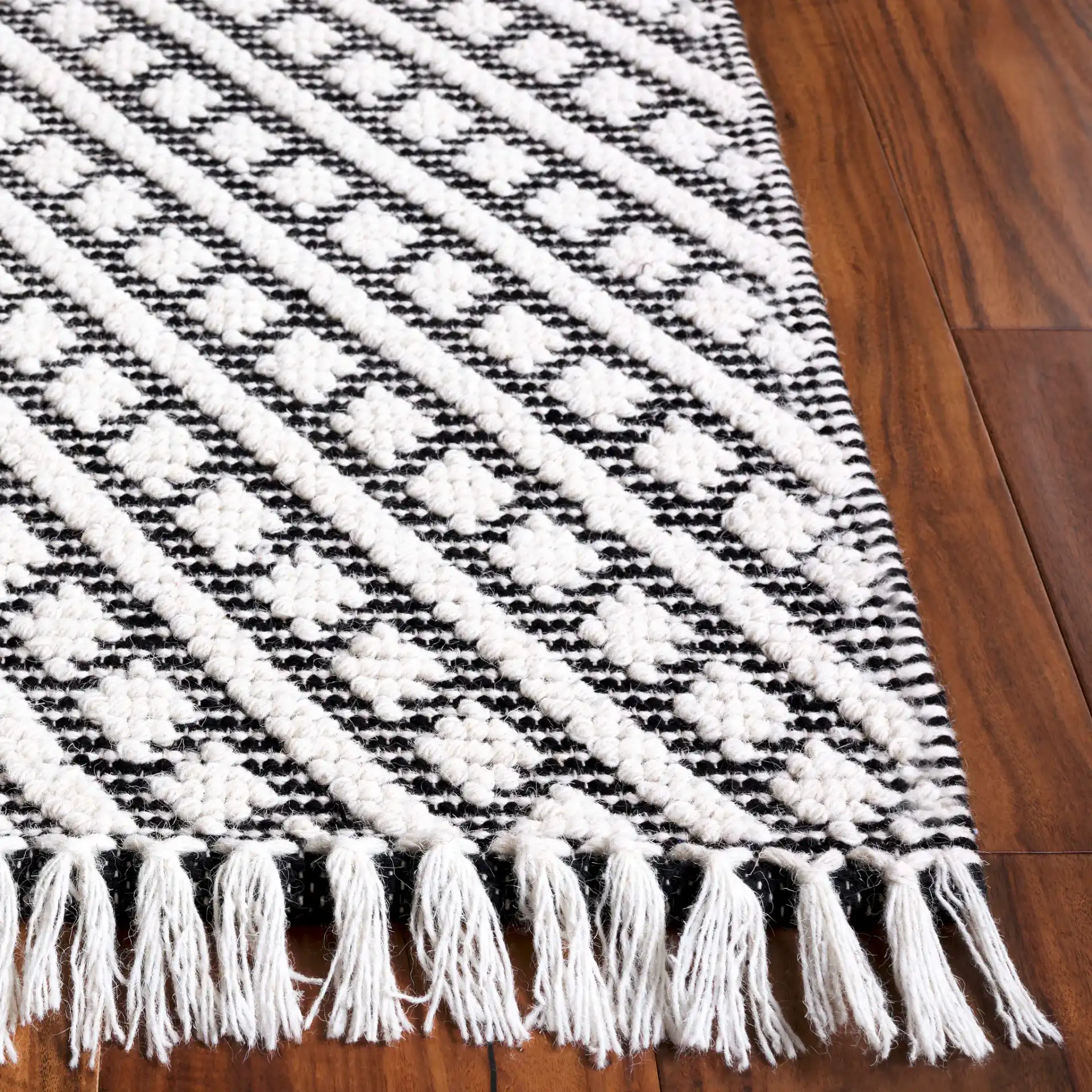 Natura Concentric Chevron Hand-Loomed Wool Rug in Ivory / Black in a styled room