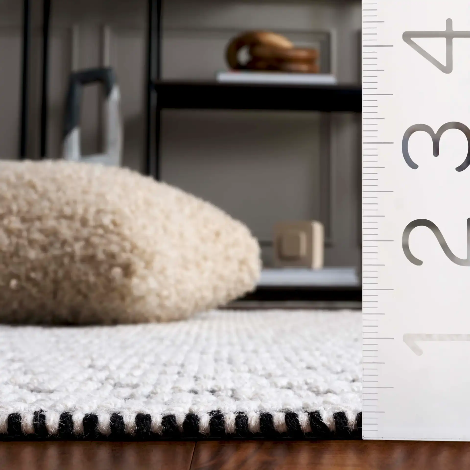 Natura Concentric Chevron Hand-Loomed Wool Rug in Ivory / Black in a styled room