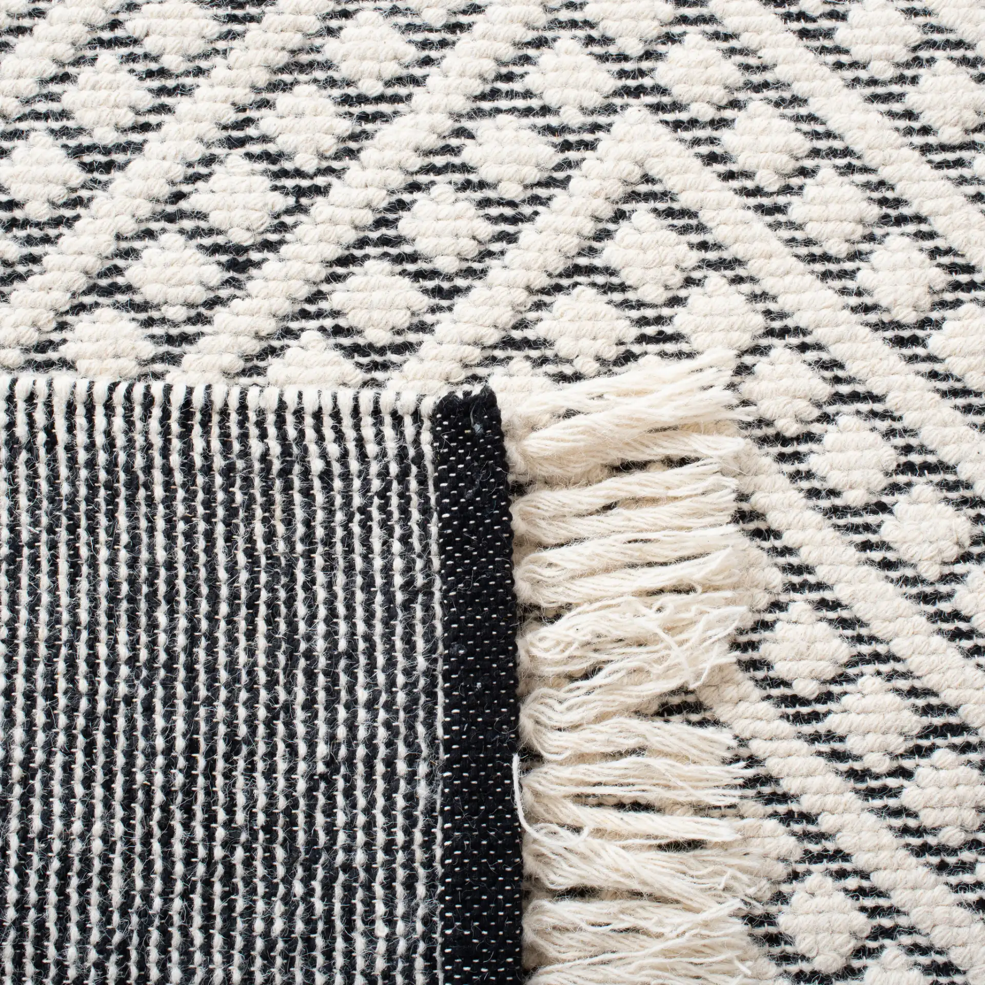 Natura Concentric Chevron Hand-Loomed Wool Rug in Ivory / Black in a styled room