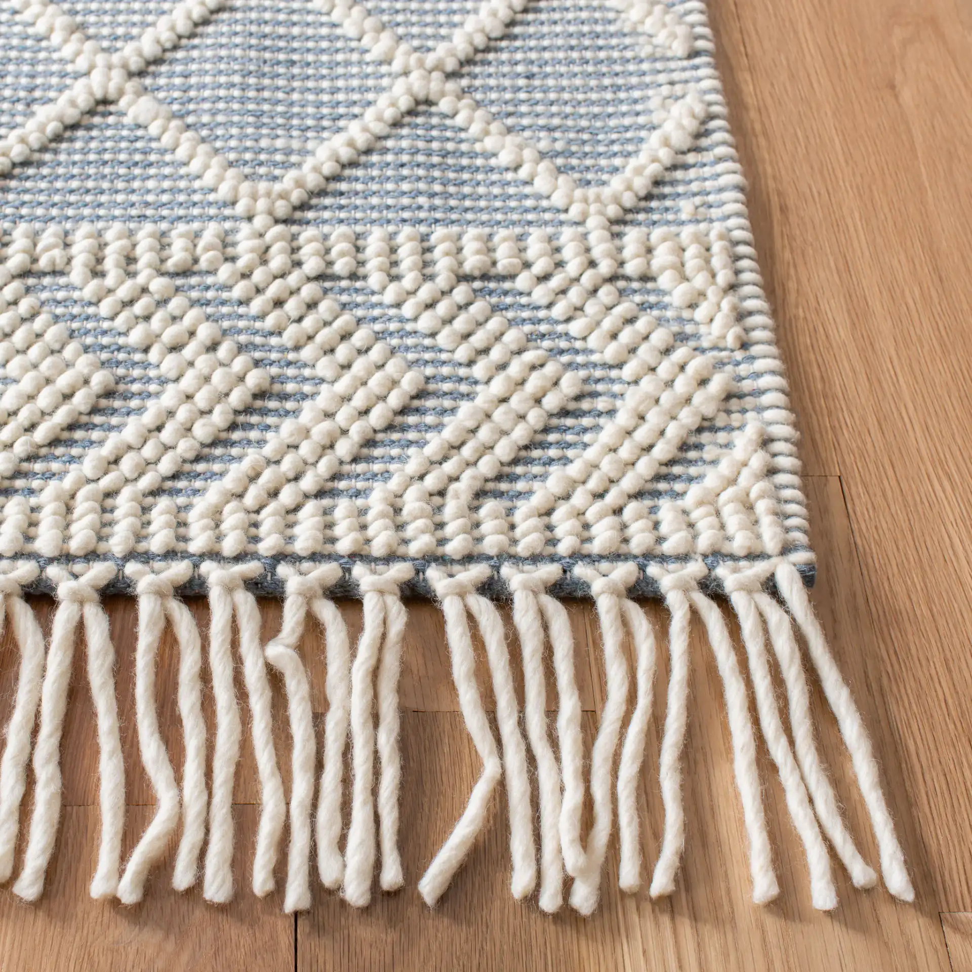 Natura Diamond And Chevron Hand-Loomed Rug in Blue / Ivory in a styled room