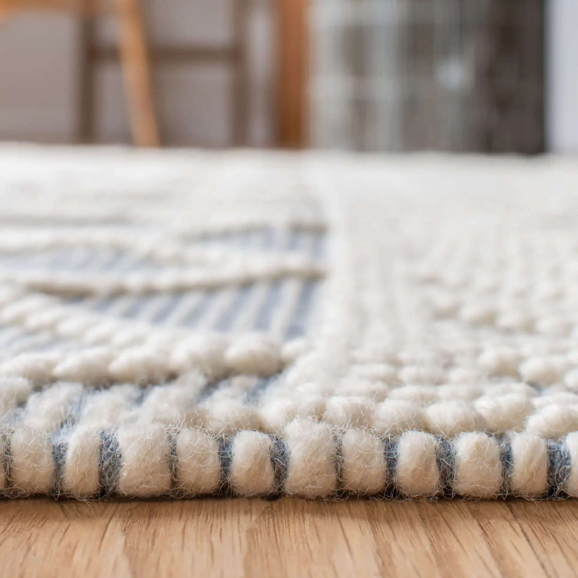 Natura Diamond And Chevron Hand-Loomed Rug in Blue / Ivory in a styled room