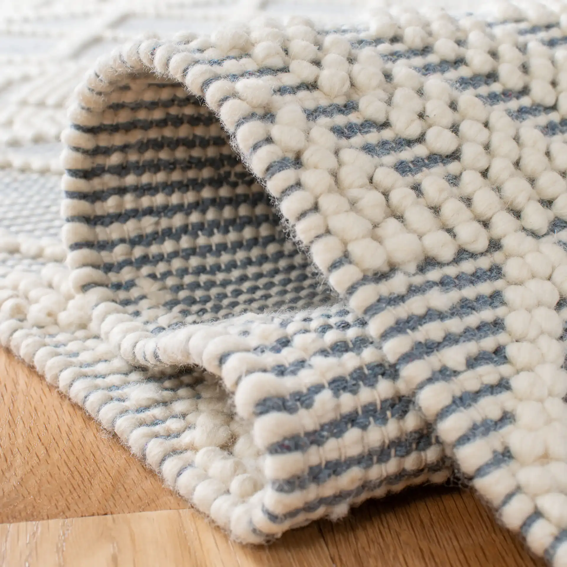 Natura Diamond And Chevron Hand-Loomed Rug in Blue / Ivory in a styled room