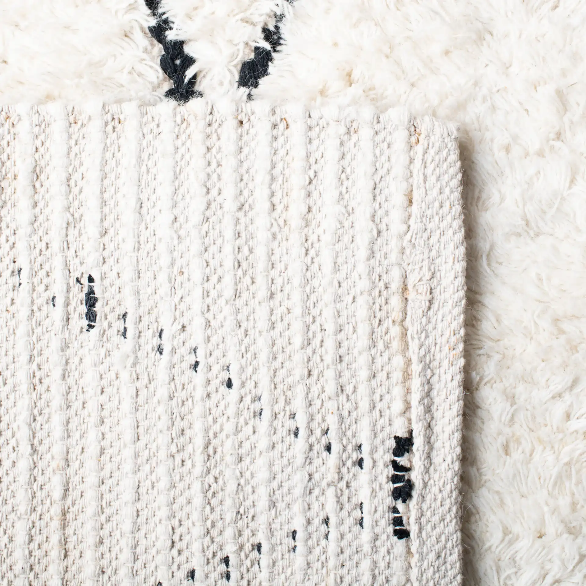 Natura Diamond Trellis Hand-Woven Shag Wool Rug in Ivory / Black in a styled room