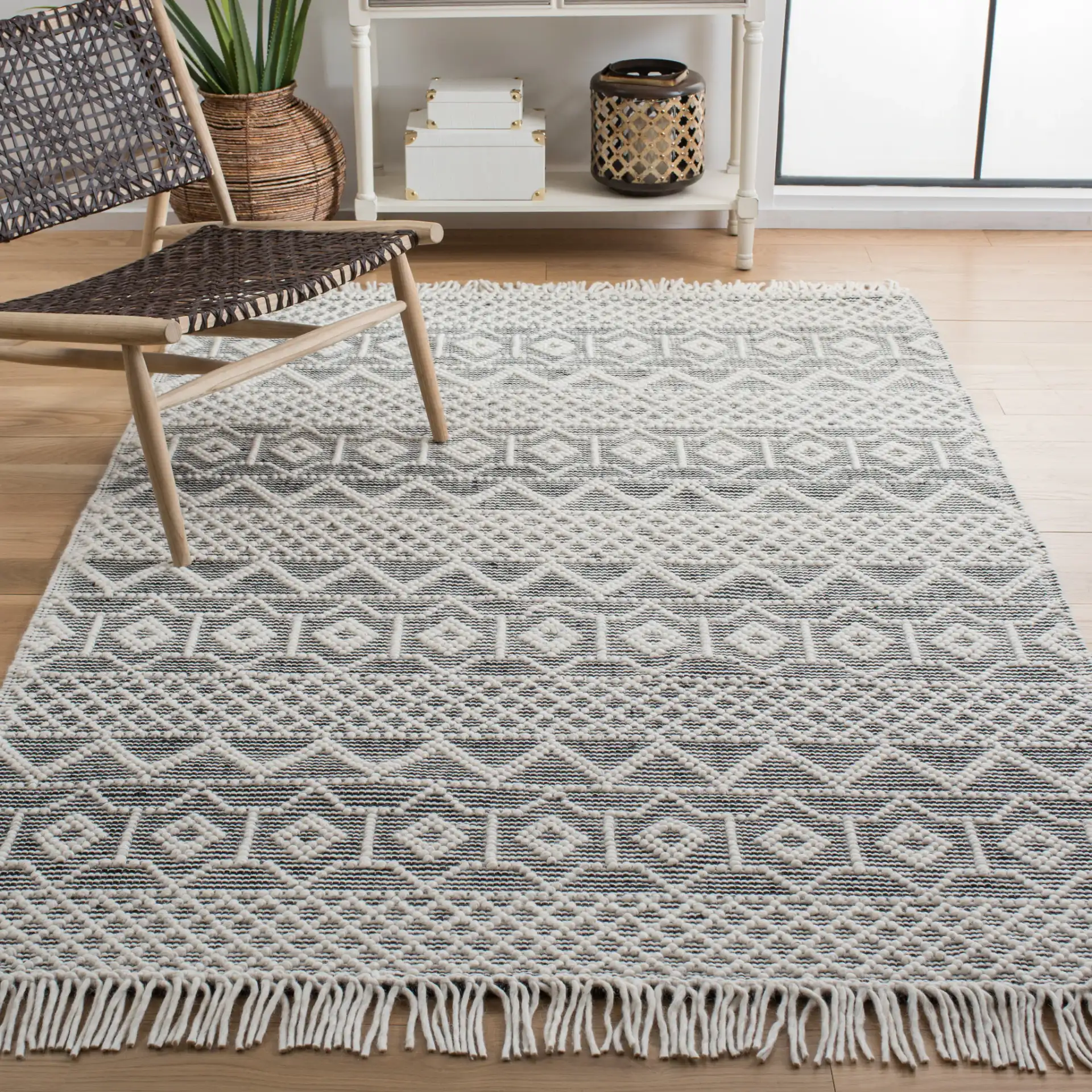 Natura Tribal Chevron Stripe Hand-Loomed Wool Rug in Ivory / Black in a styled room