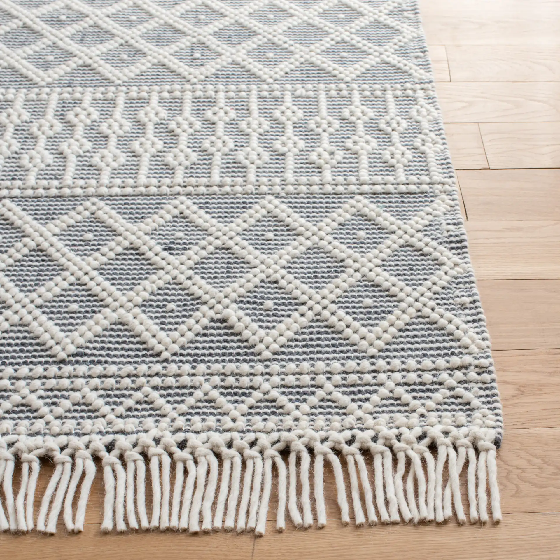 Natura Banded Trellis Diamond Hand-Loomed Wool Rug in Ivory / Gray in a styled room