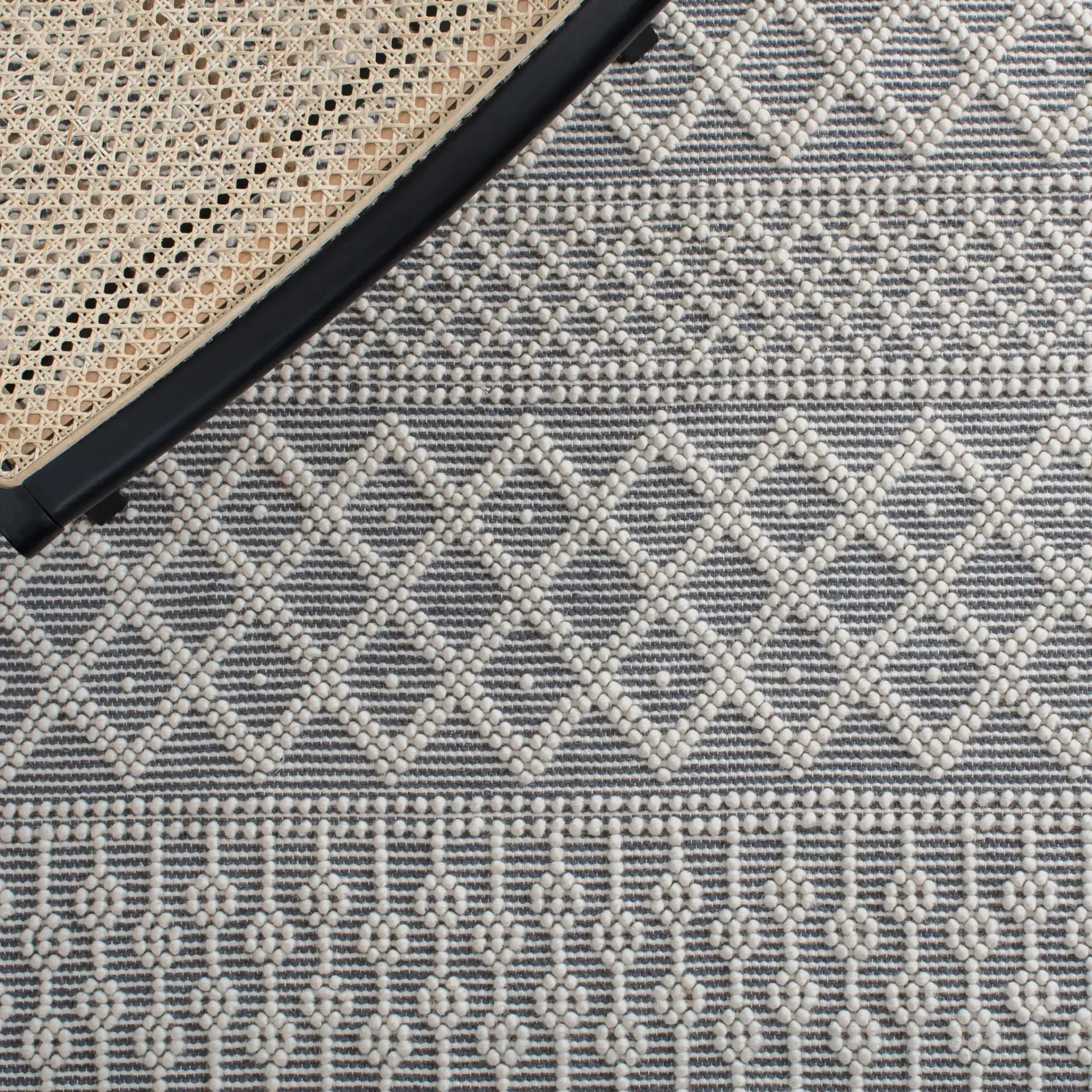 Natura Banded Trellis Diamond Hand-Loomed Wool Rug in Ivory / Gray in a styled room