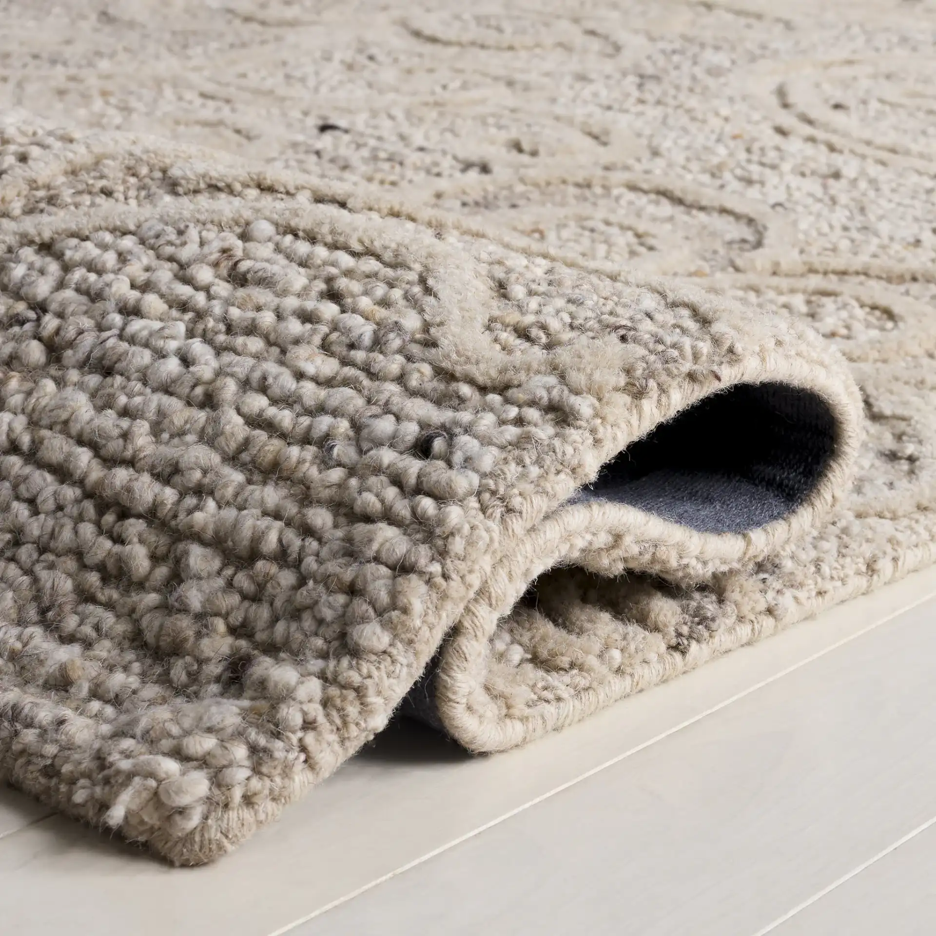 Natura Transitional Floral Hand-Tufted Wool Rug in Beige in a styled room