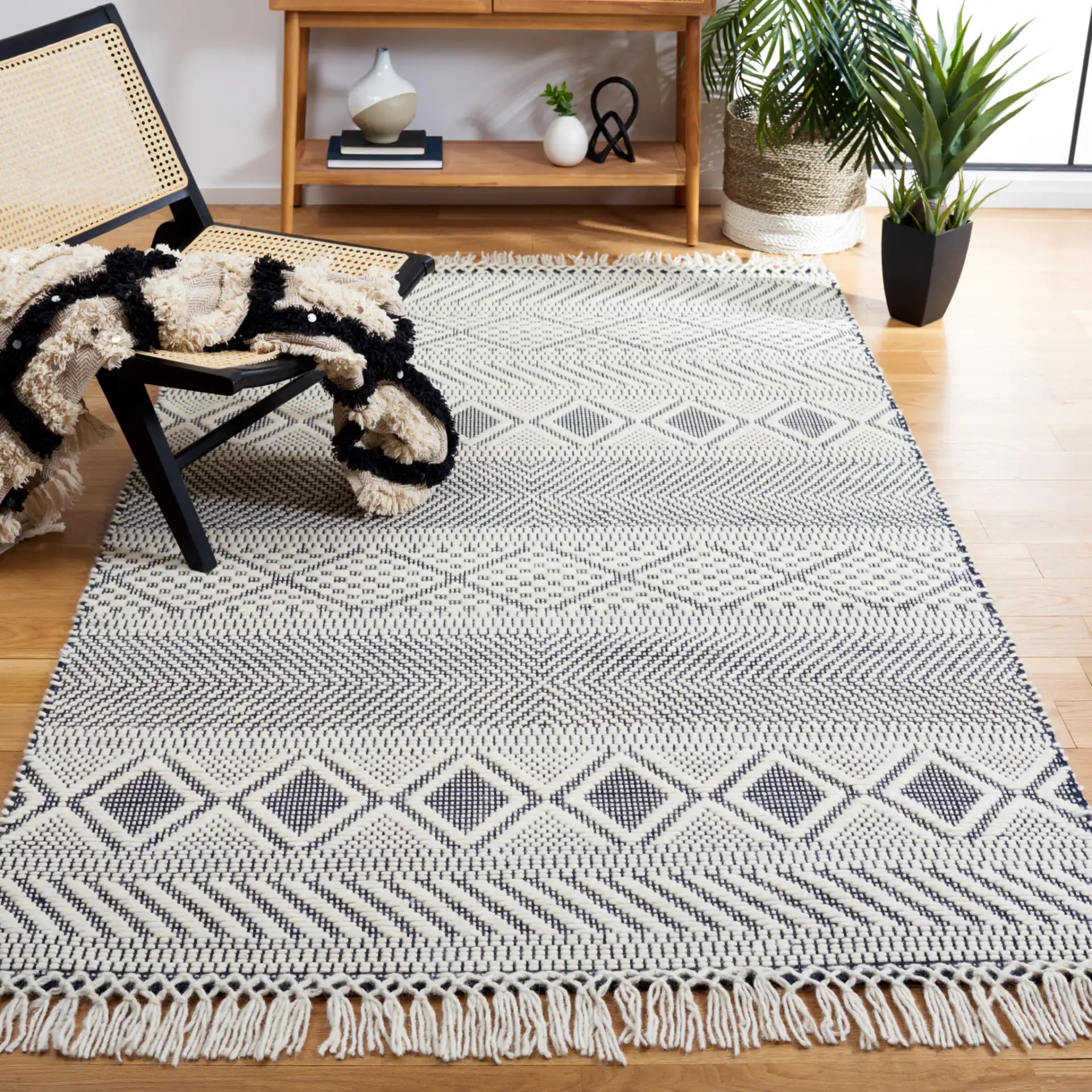 Natura Banded Lozenge Geometric Hand-Woven Wool Rug in Ivory / Navy in a styled room
