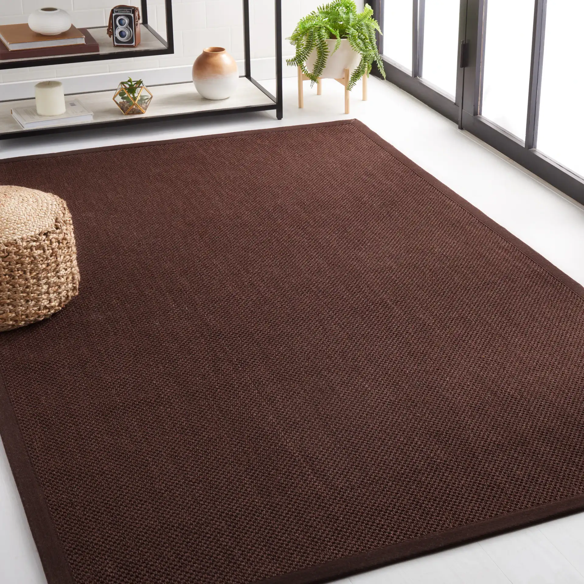Natural Fiber Bordered Boucle Grid Sisal Rug in Chocolate / Dark Brown in a styled room