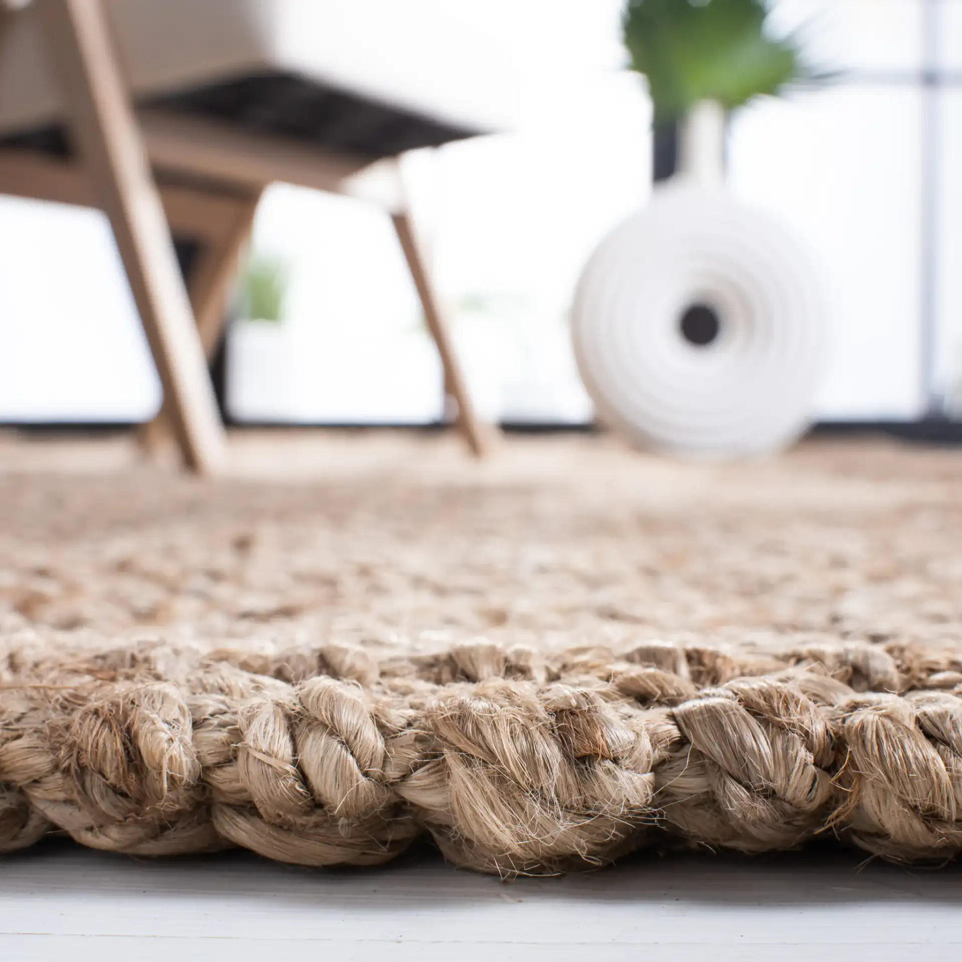 Natural Fiber Pebble Loop Hand-Loomed Jute Rug in Natural in a styled room