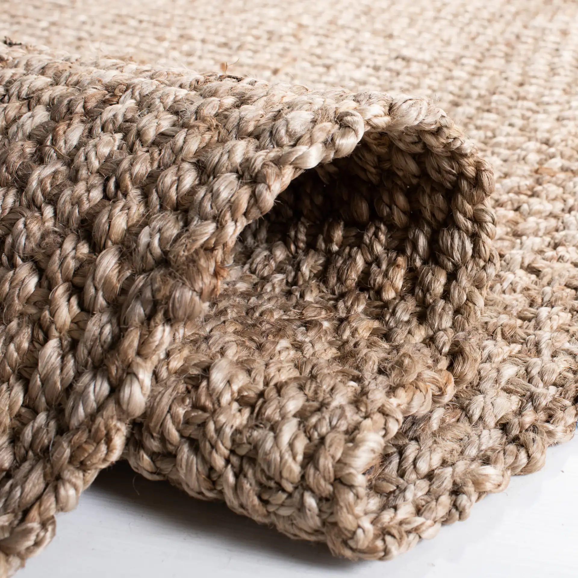 Natural Fiber Pebble Loop Hand-Loomed Jute Rug in Natural in a styled room