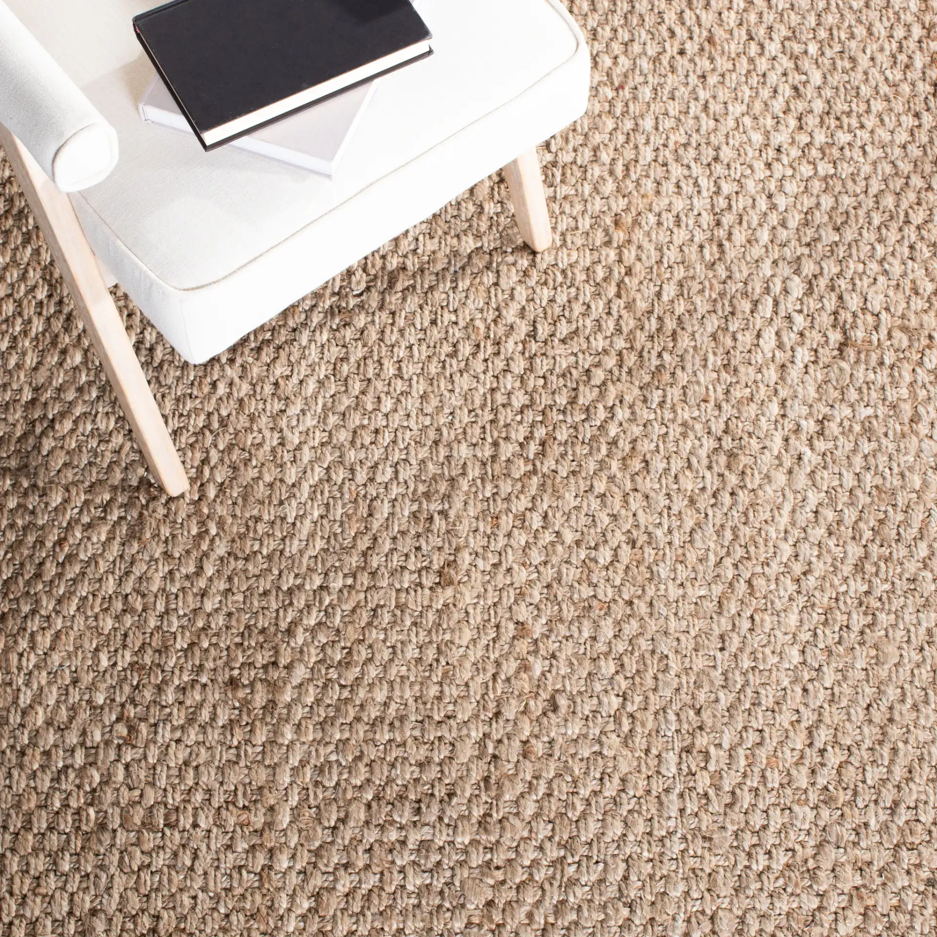Natural Fiber Pebble Loop Hand-Loomed Jute Rug in Natural in a styled room
