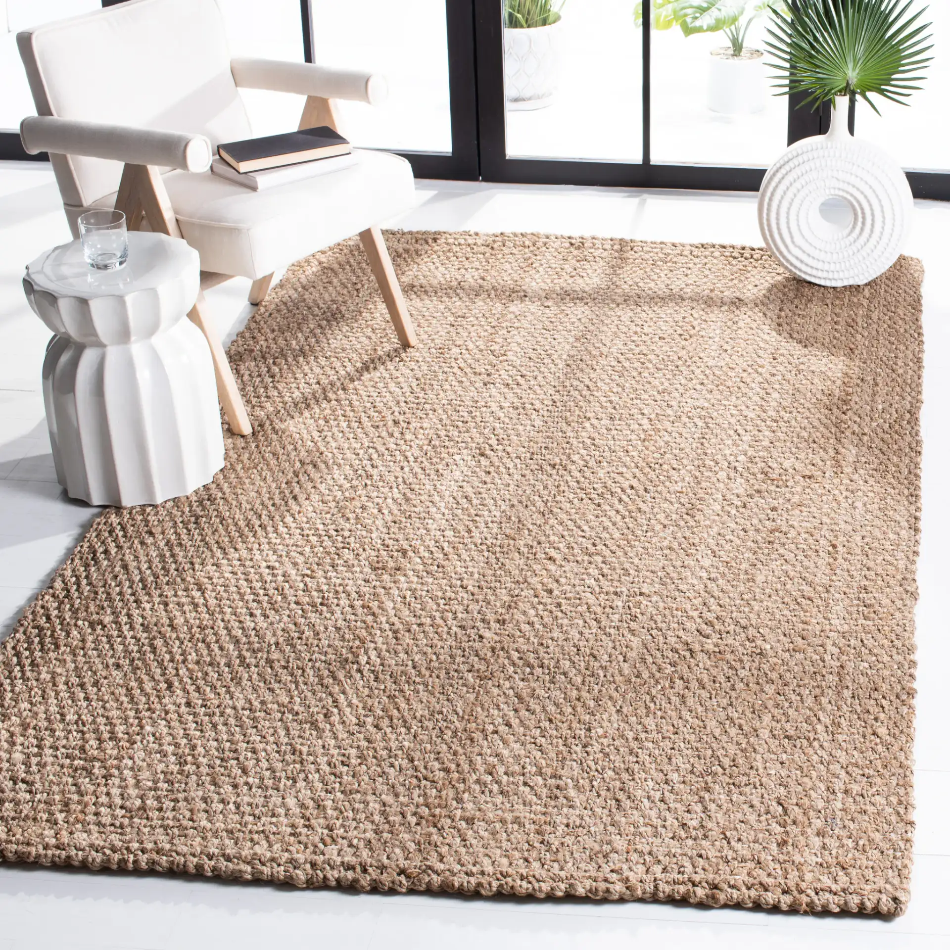 Natural Fiber Pebble Loop Hand-Loomed Jute Rug in Natural in a styled room