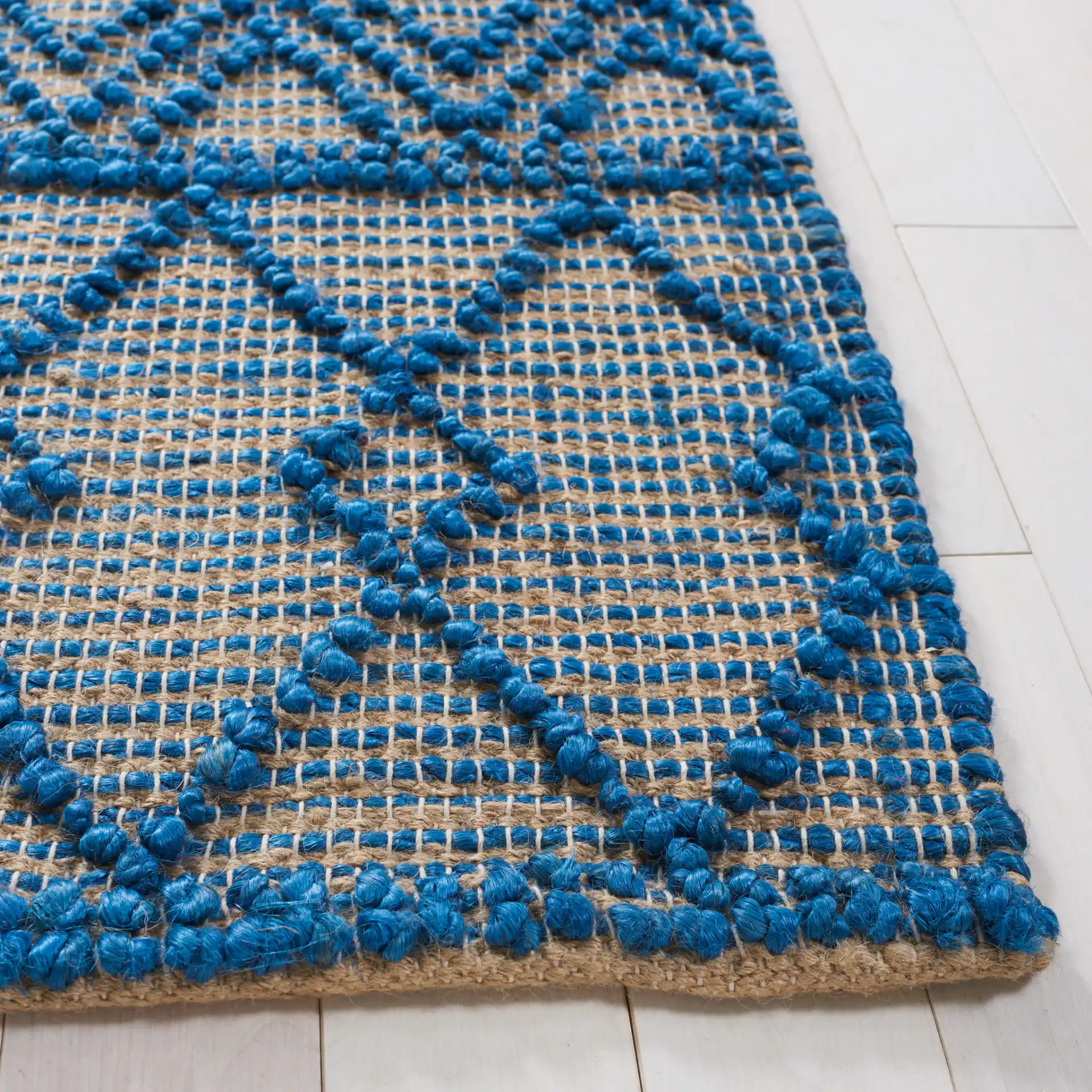 Natural Fiber Banded Chevron Flatweave Jute Rug in Blue / Natural in a styled room