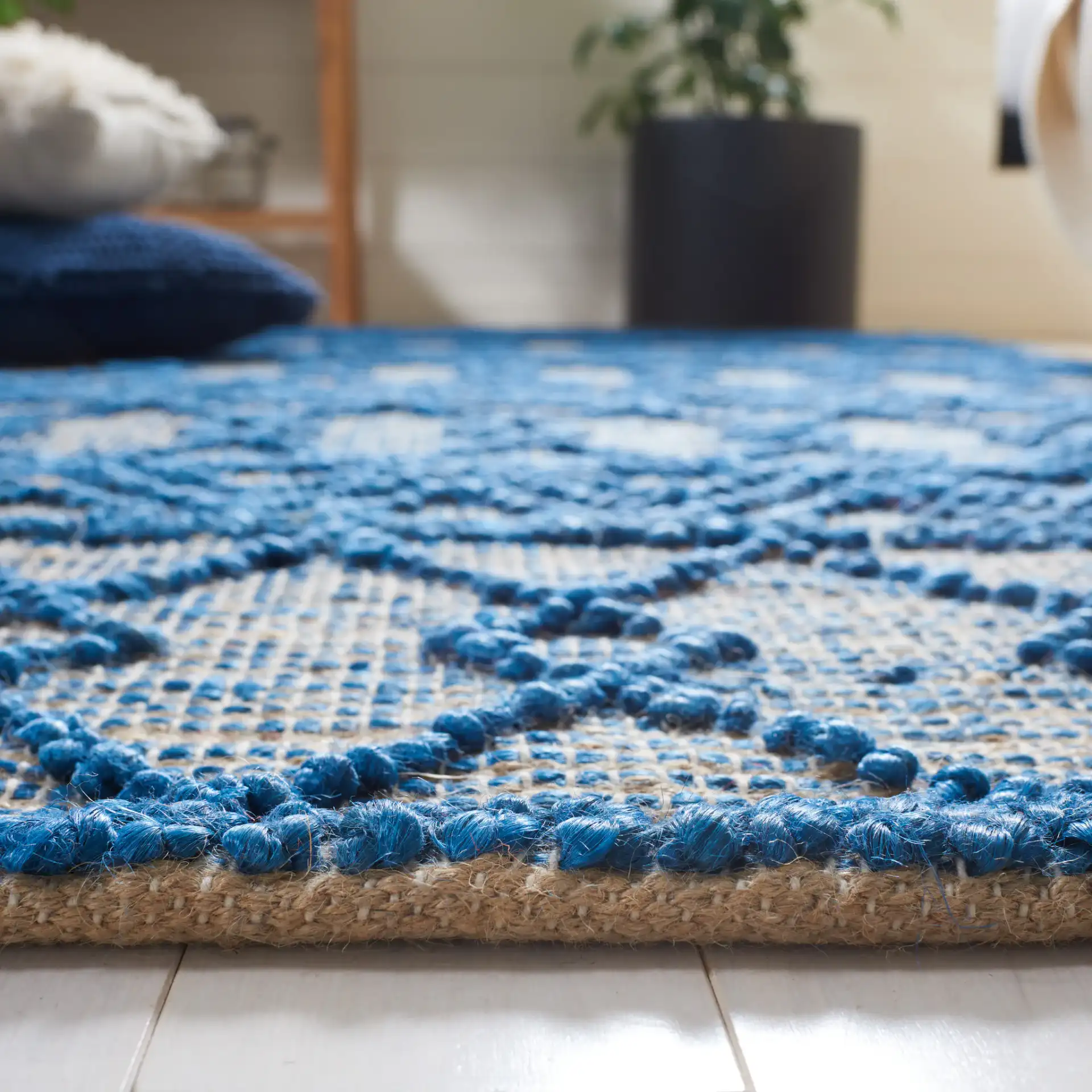 Natural Fiber Banded Chevron Flatweave Jute Rug in Blue / Natural in a styled room