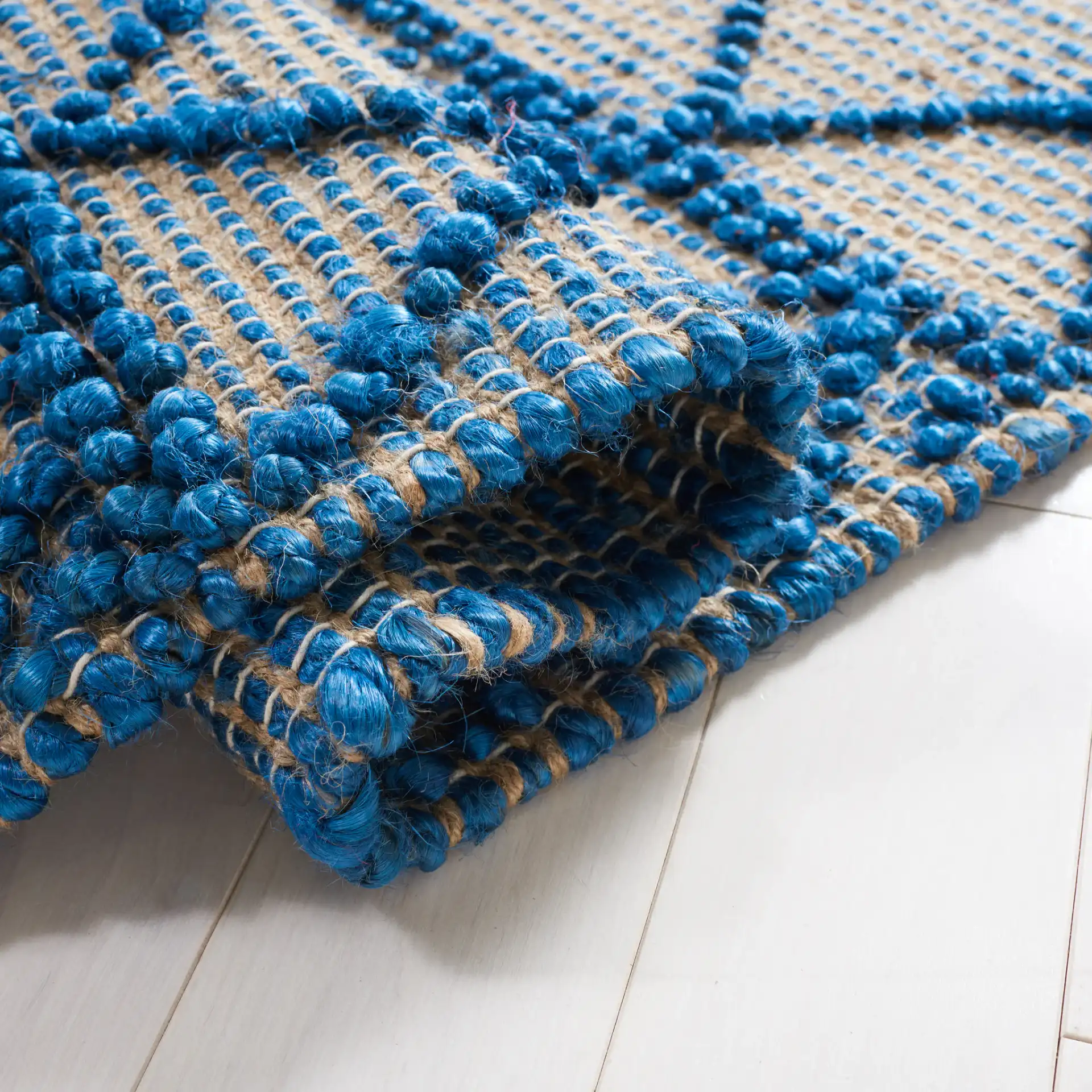 Natural Fiber Banded Chevron Flatweave Jute Rug in Blue / Natural in a styled room