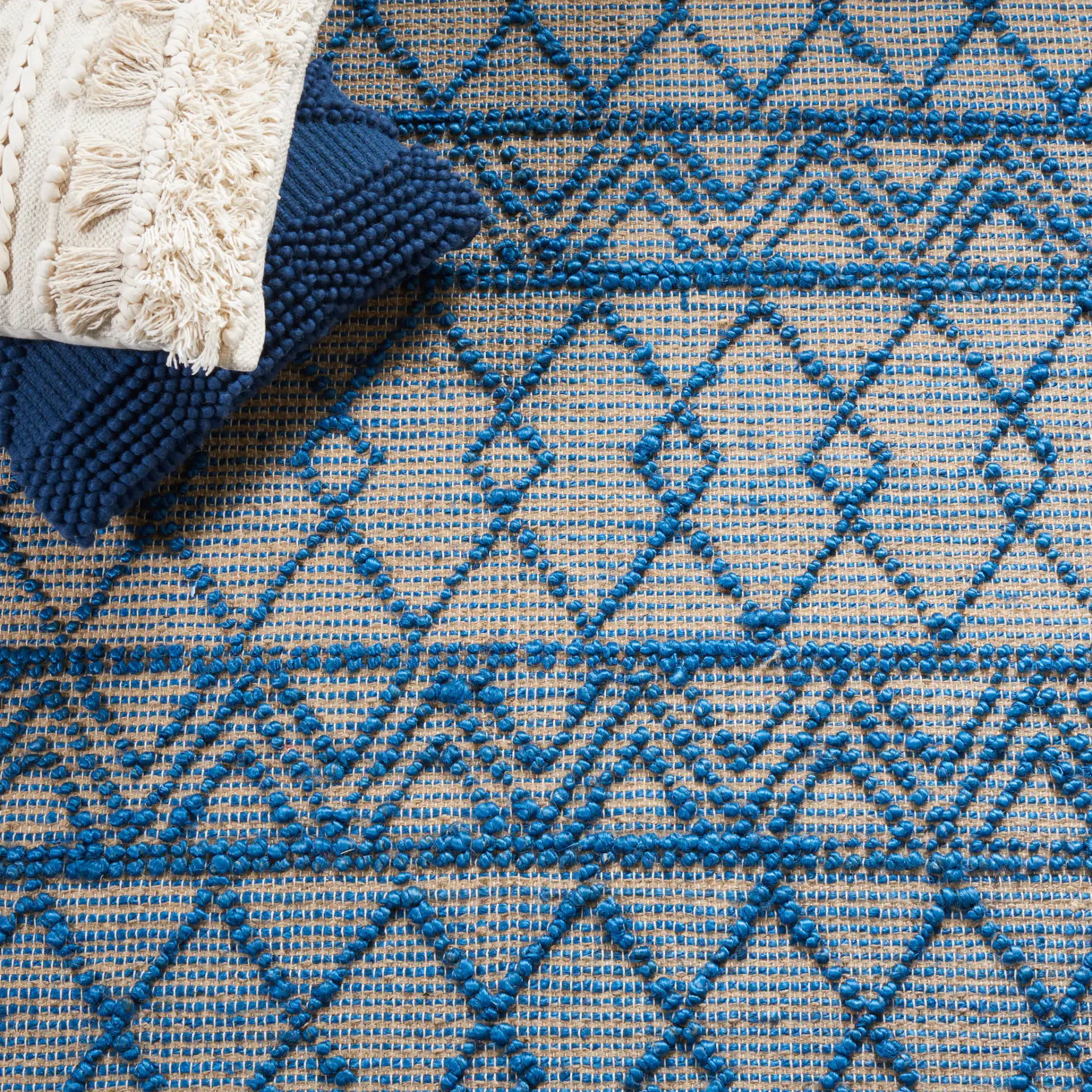 Natural Fiber Banded Chevron Flatweave Jute Rug in Blue / Natural in a styled room
