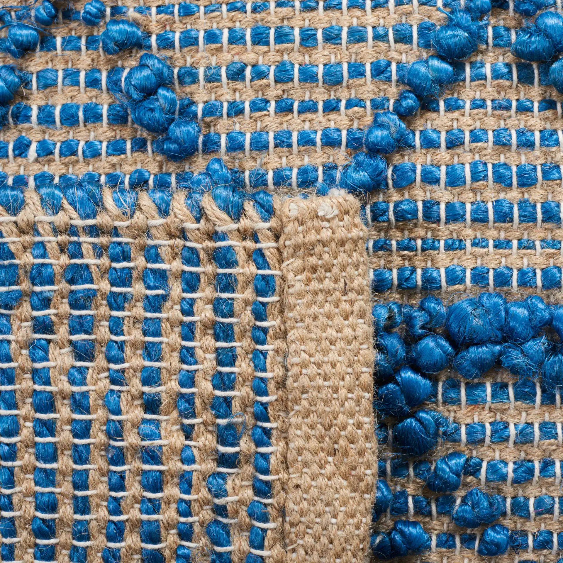 Natural Fiber Banded Chevron Flatweave Jute Rug in Blue / Natural in a styled room