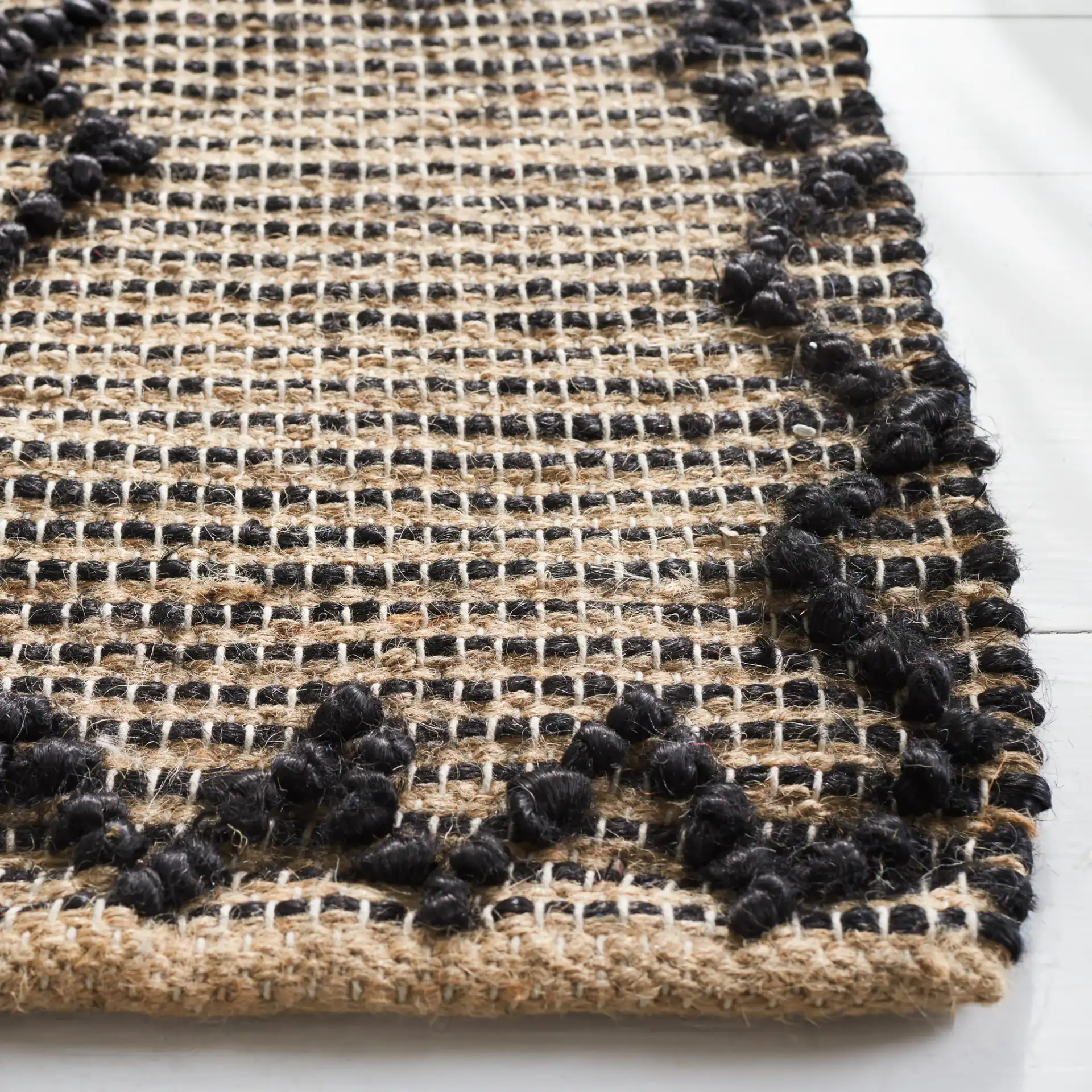 Natural Fiber Diamond Grid Flatweave Jute Rug in Black / Natural in a styled room