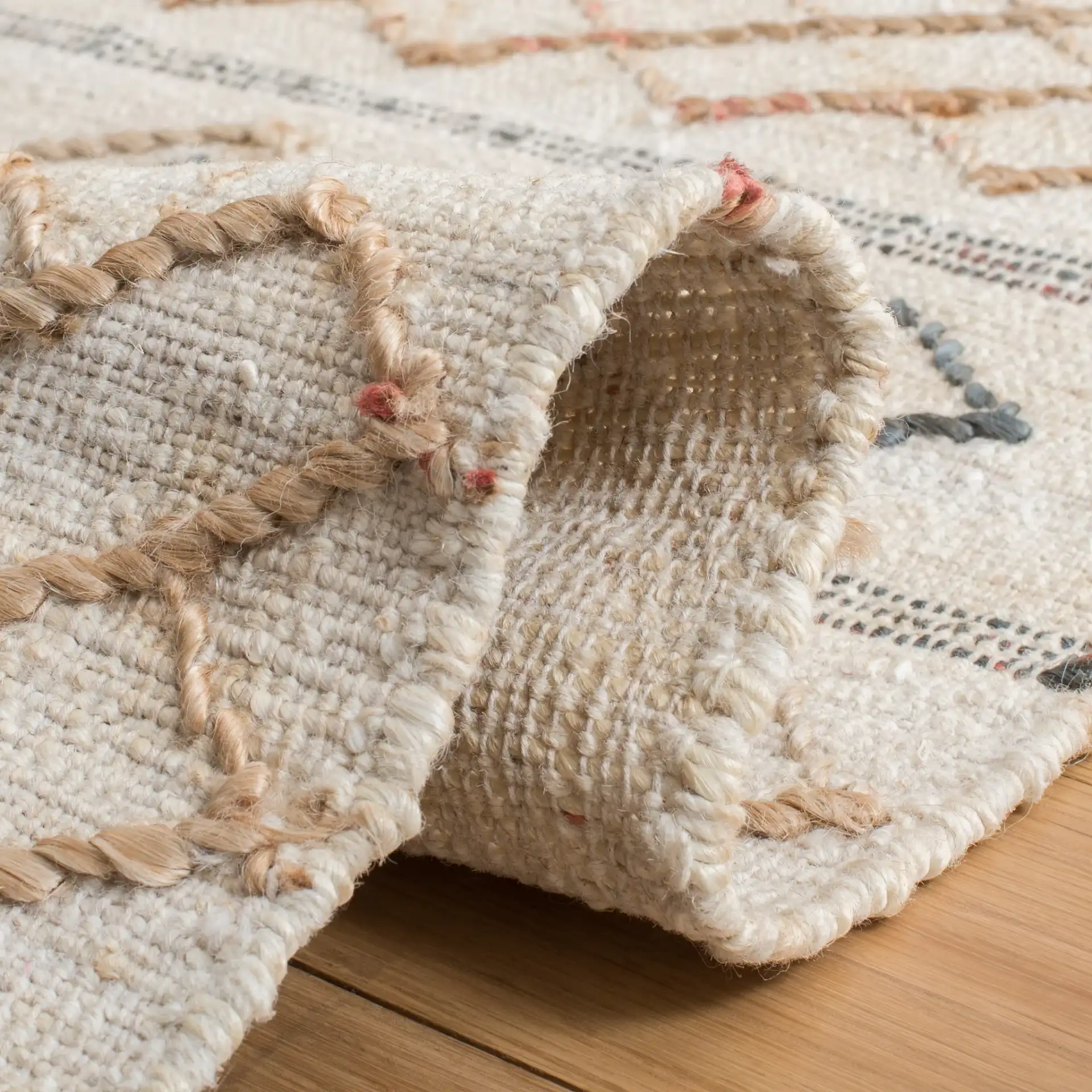 Natural Fiber Diamond Banded Hand-Loomed Jute Rug in Natural / Ivory in a styled room