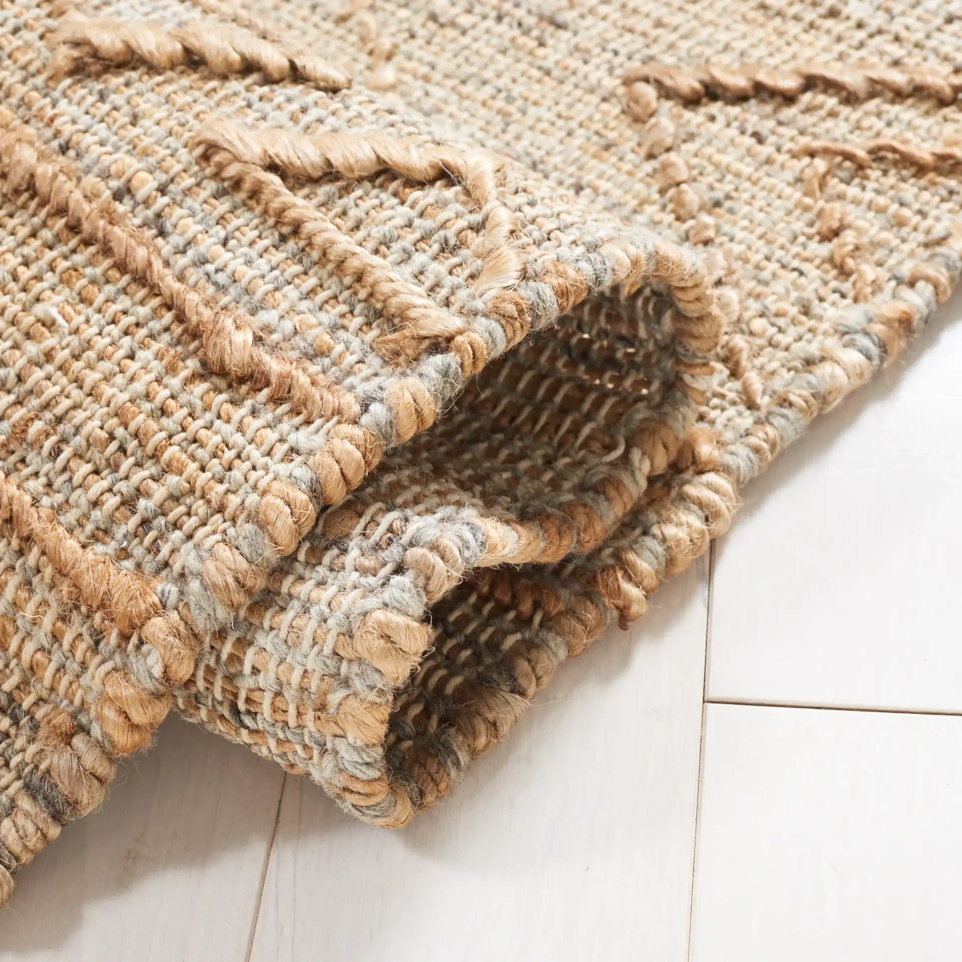 Natural Fiber Banded Chevron Hand-Loomed Jute Rug in Natural in a styled room