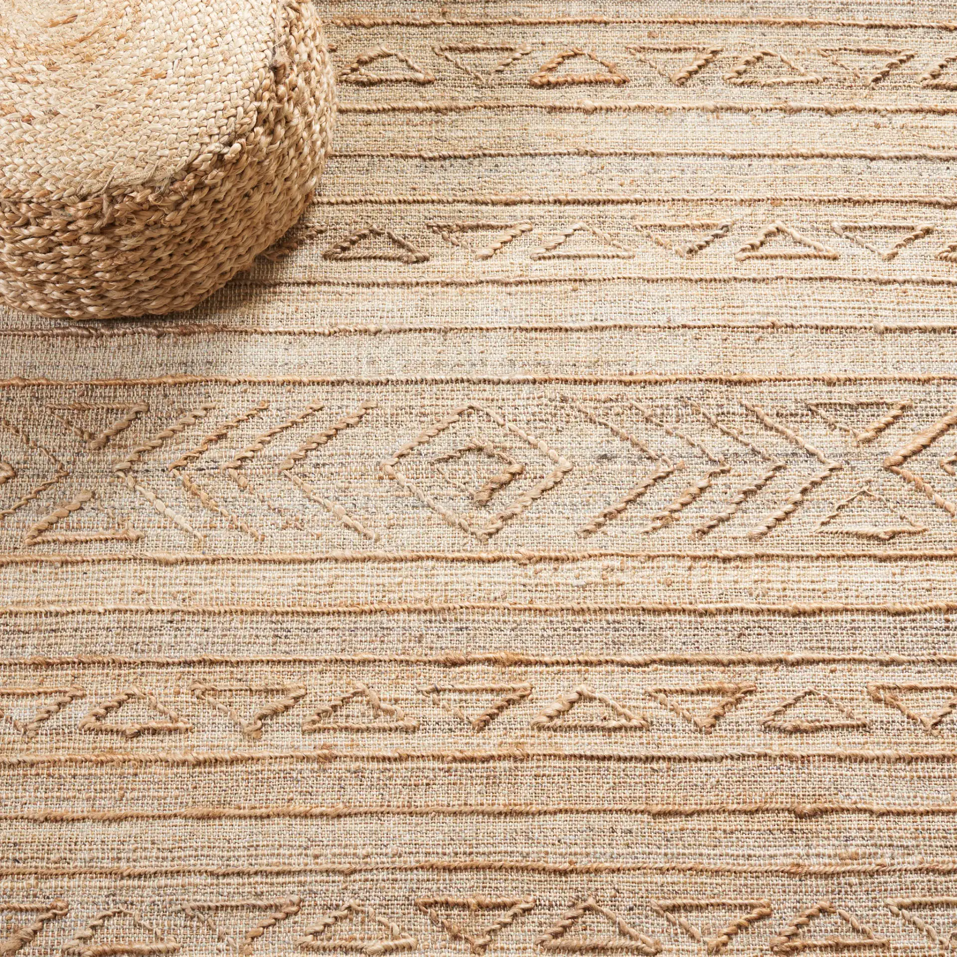 Natural Fiber Banded Chevron Hand-Loomed Jute Rug in Natural in a styled room