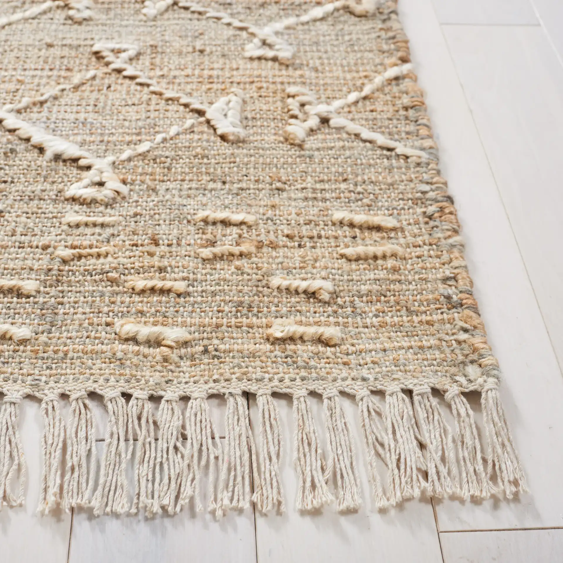 Natural Fiber Banded Geometric Hand-Loomed Jute Rug in Natural / Ivory in a styled room