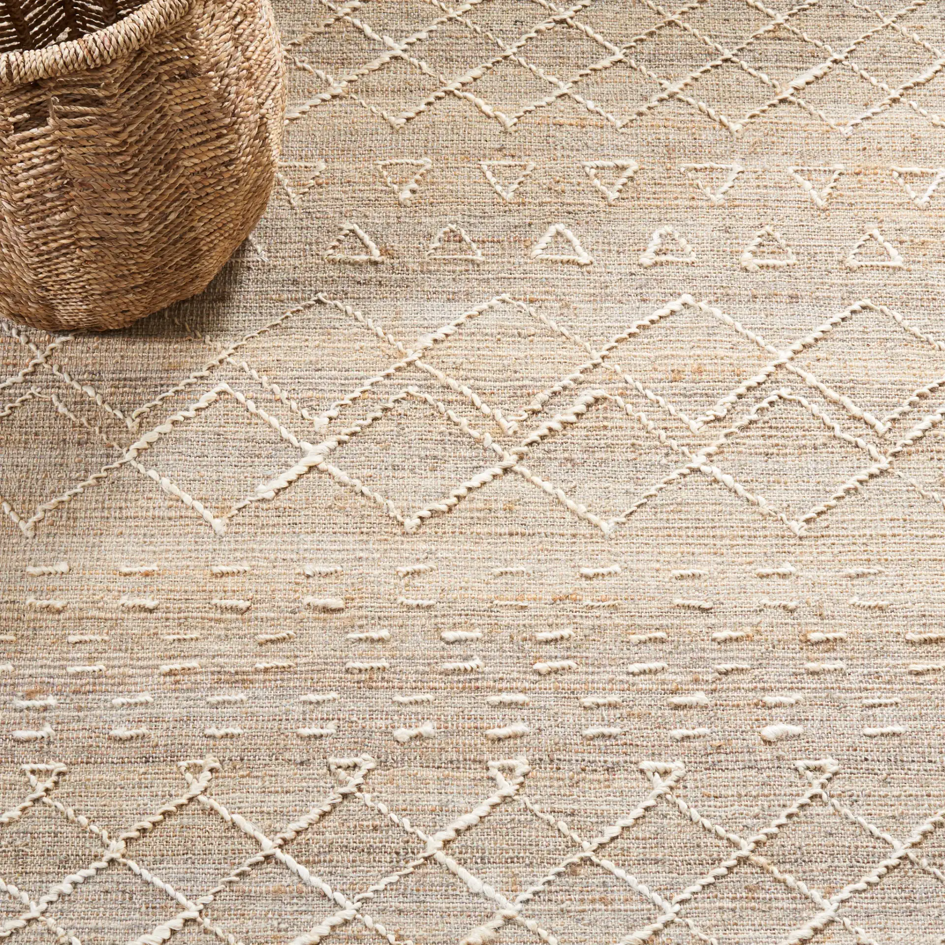 Natural Fiber Banded Geometric Hand-Loomed Jute Rug in Natural / Ivory in a styled room