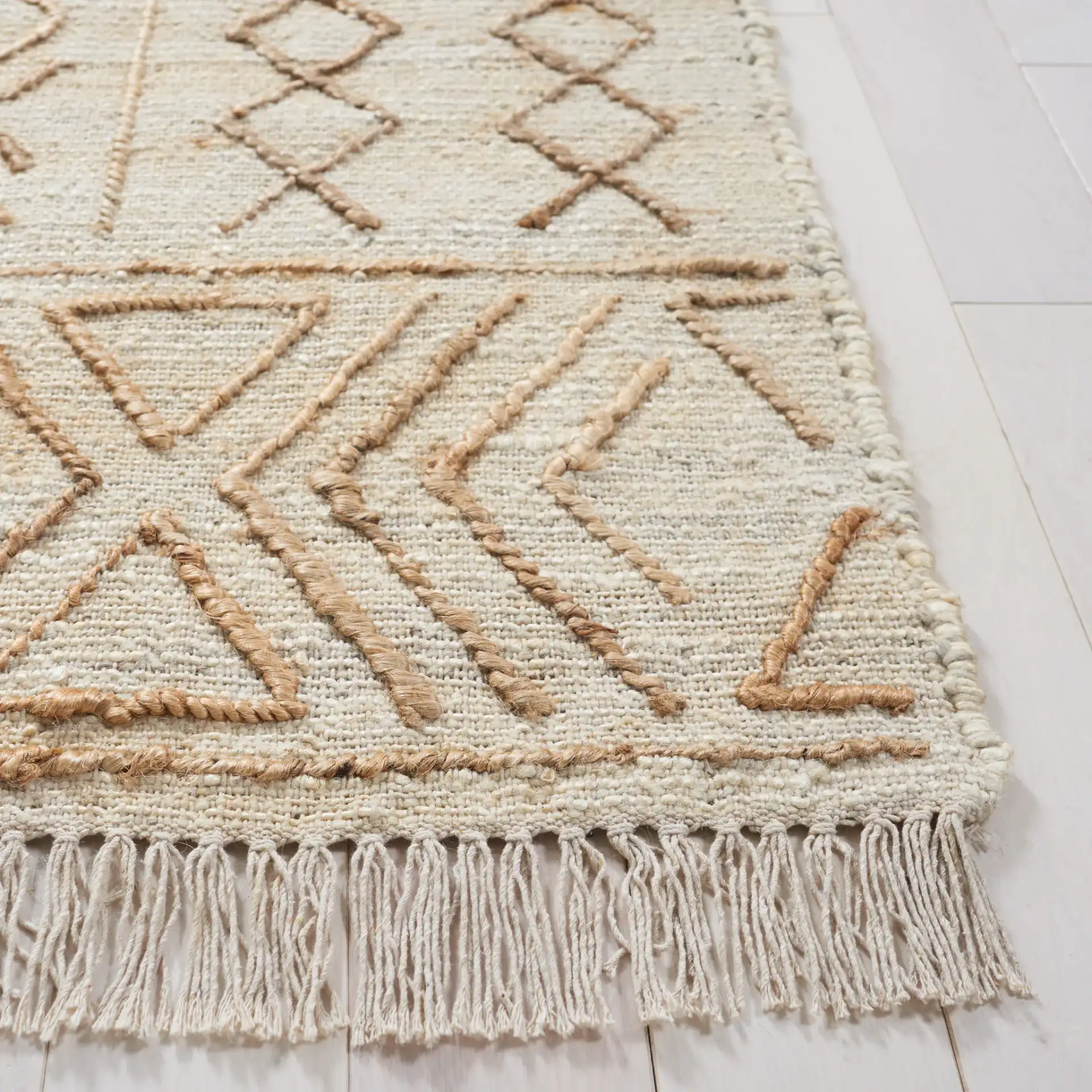 Natural Fiber Geometric Banded Hand-Loomed Jute Rug in Natural / Beige in a styled room