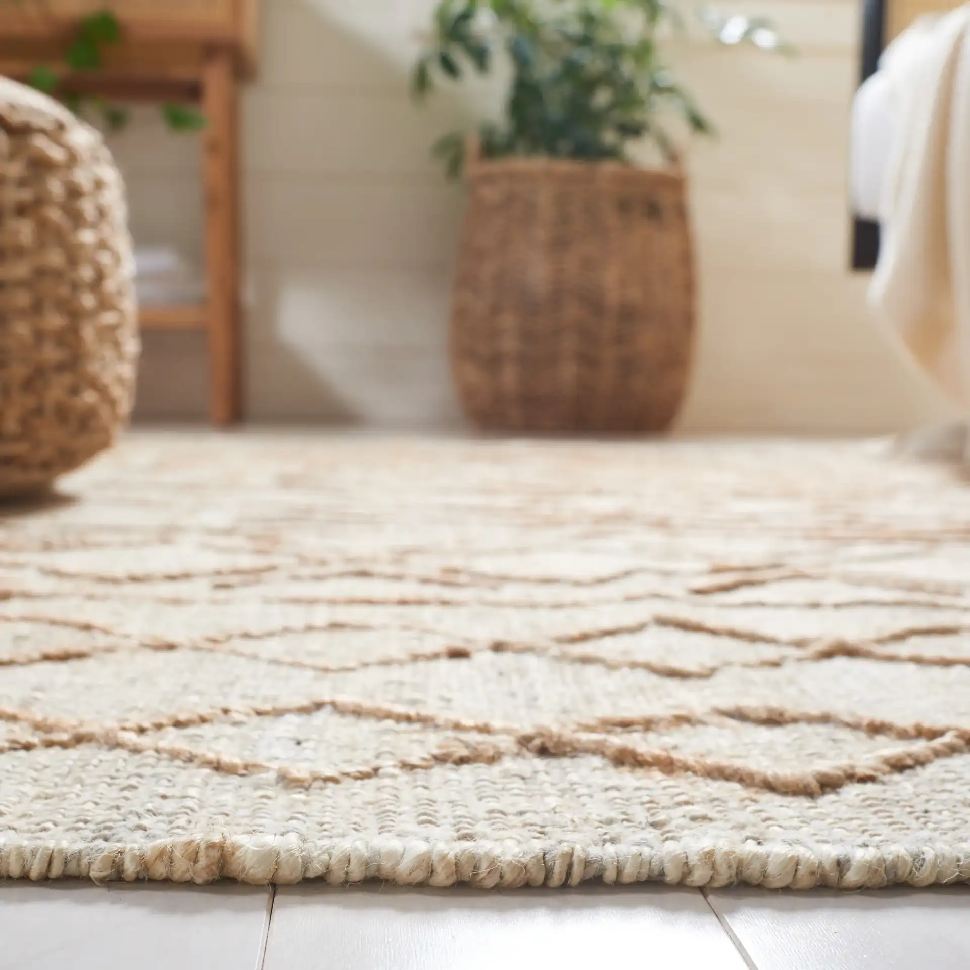 Natural Fiber Geometric Banded Hand-Loomed Jute Rug in Natural / Beige in a styled room