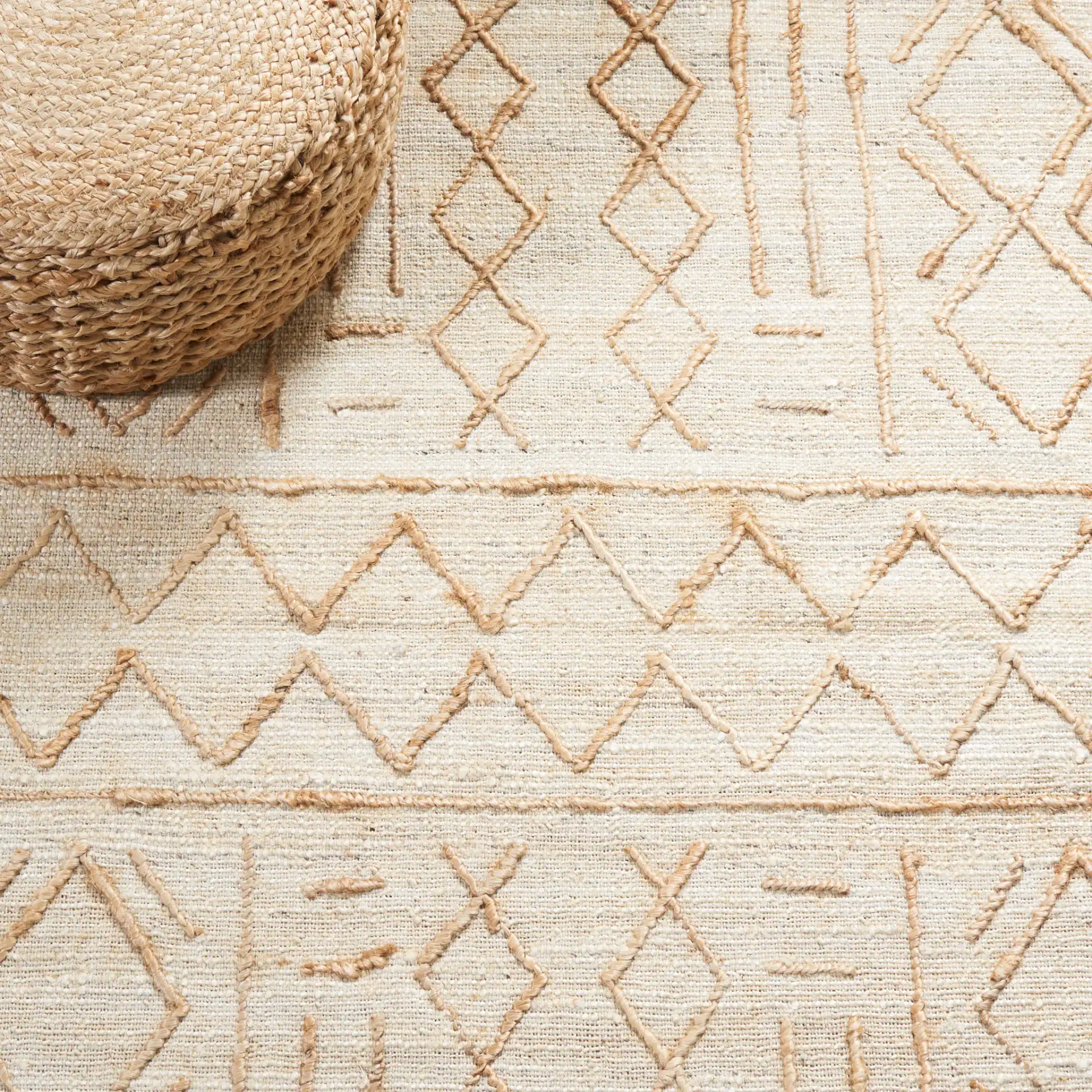 Natural Fiber Geometric Banded Hand-Loomed Jute Rug in Natural / Beige in a styled room