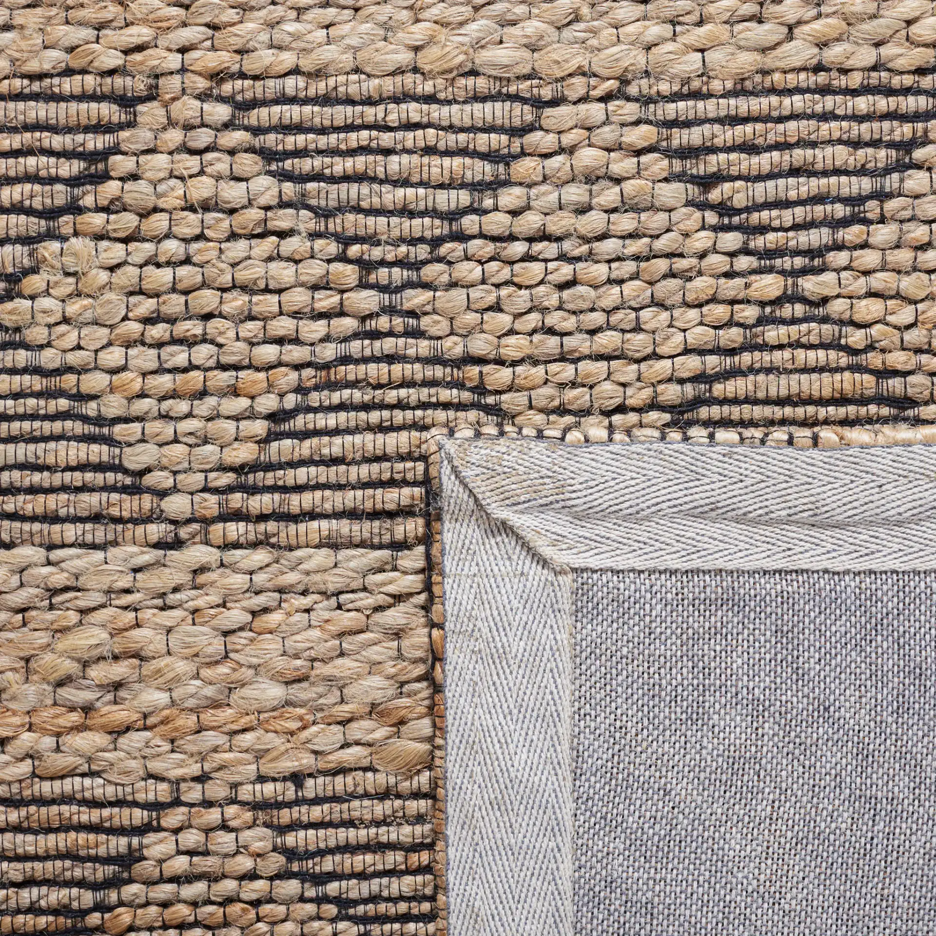 Natural Fiber Banded Diamond Hand-Tufted Rug in Natural / Black in a styled room