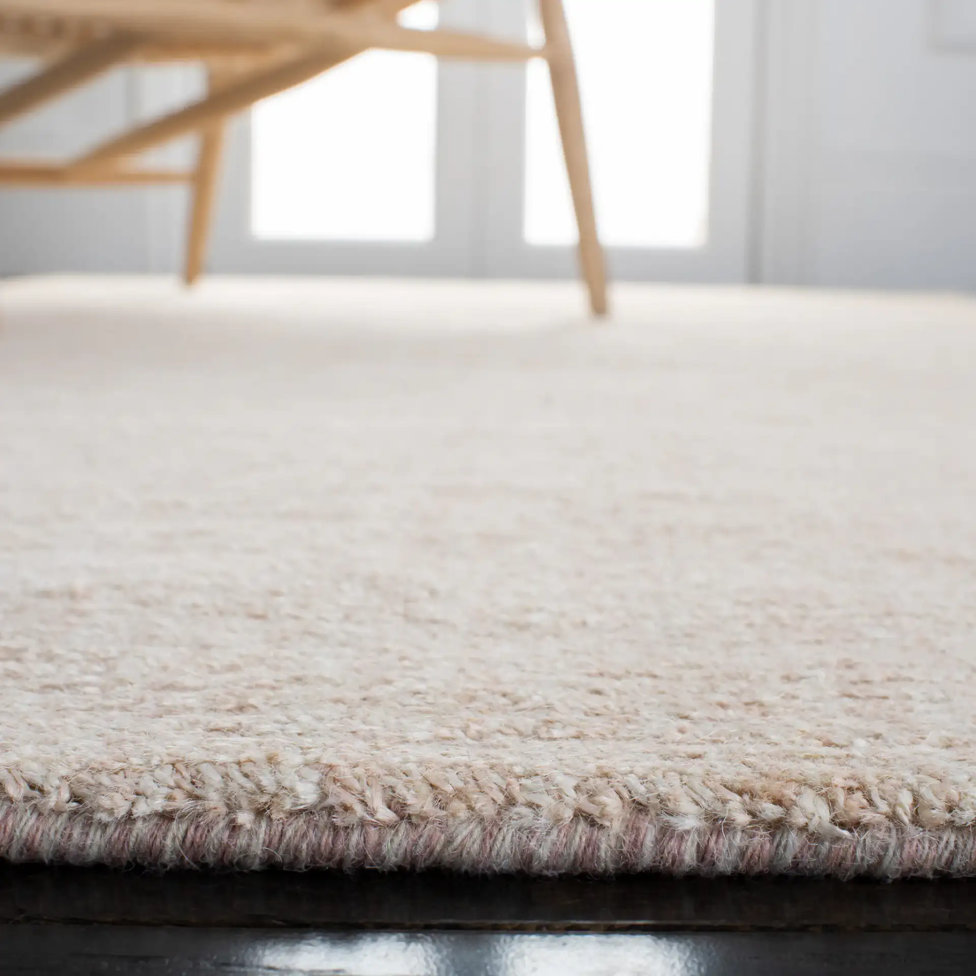 Natural Fiber Fine Ribbed Hand-Loomed Jute Rug in Light Pink in a styled room