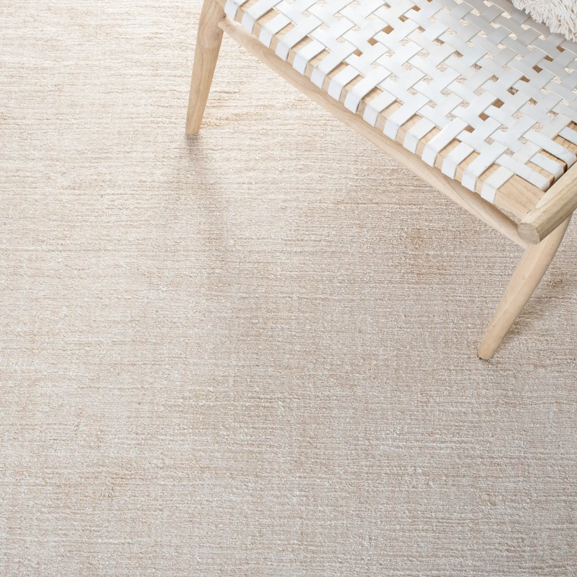 Natural Fiber Fine Ribbed Hand-Loomed Jute Rug in Light Pink in a styled room