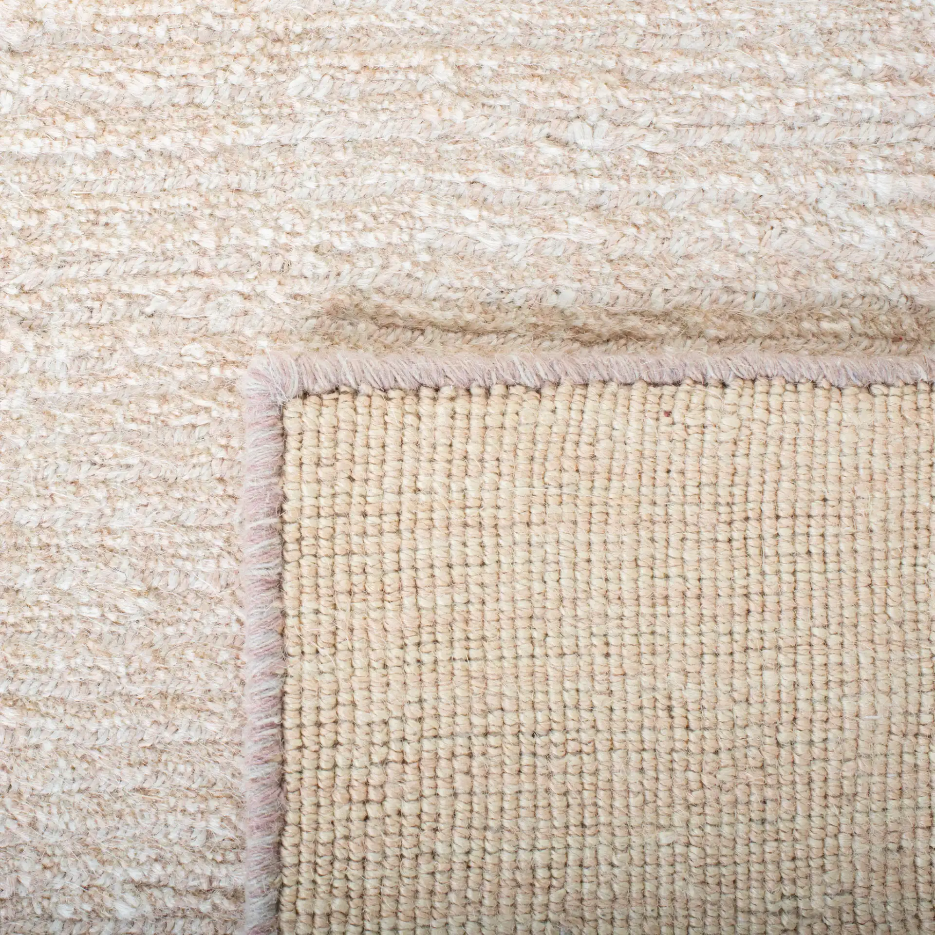Natural Fiber Fine Ribbed Hand-Loomed Jute Rug in Light Pink in a styled room
