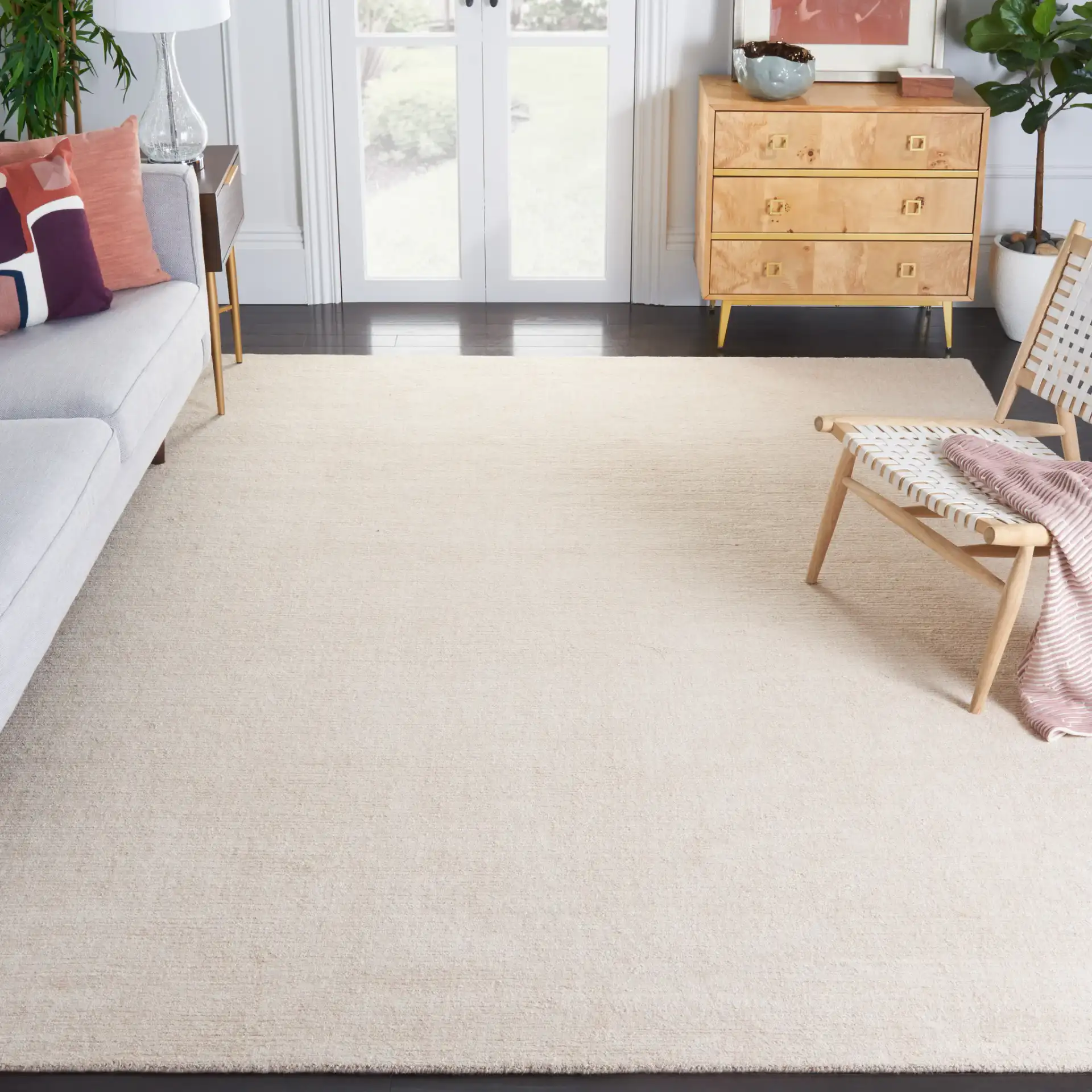 Natural Fiber Fine Ribbed Hand-Loomed Jute Rug in Light Pink in a styled room