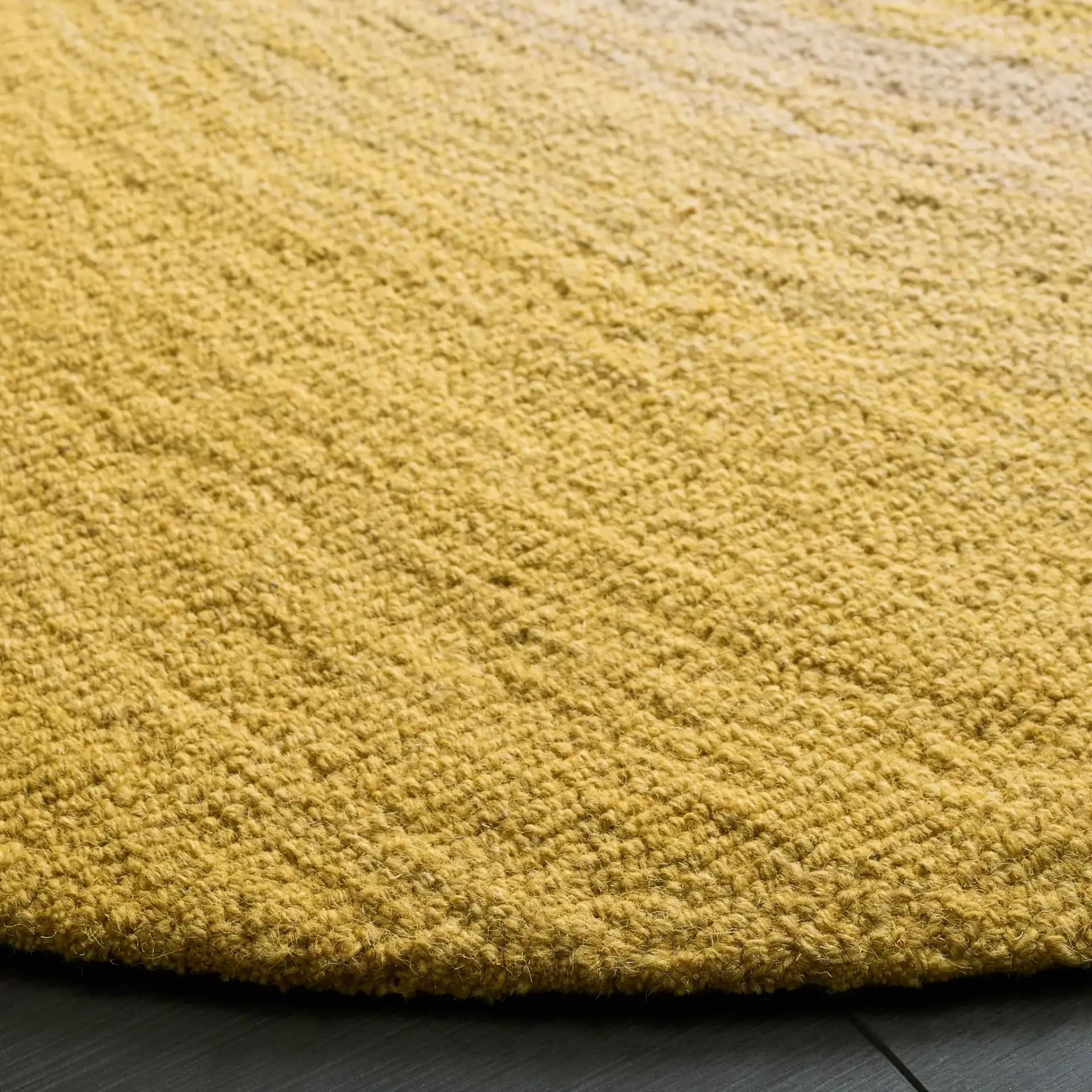 Novelty Swirl Hand-Tufted Wool Rug in Gold / Gray in a styled room