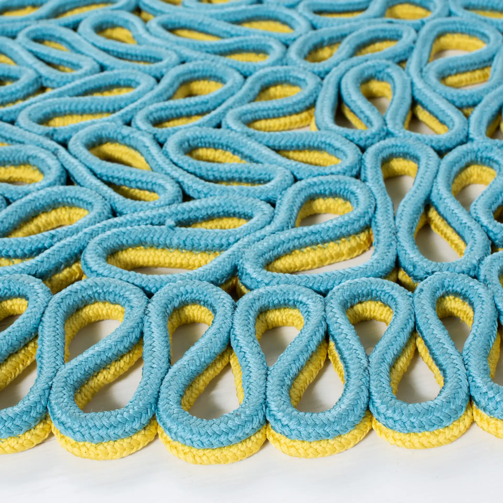 Novelty Interlocking Loop Hand-Knotted Rug in Yellow / Blue in a styled room