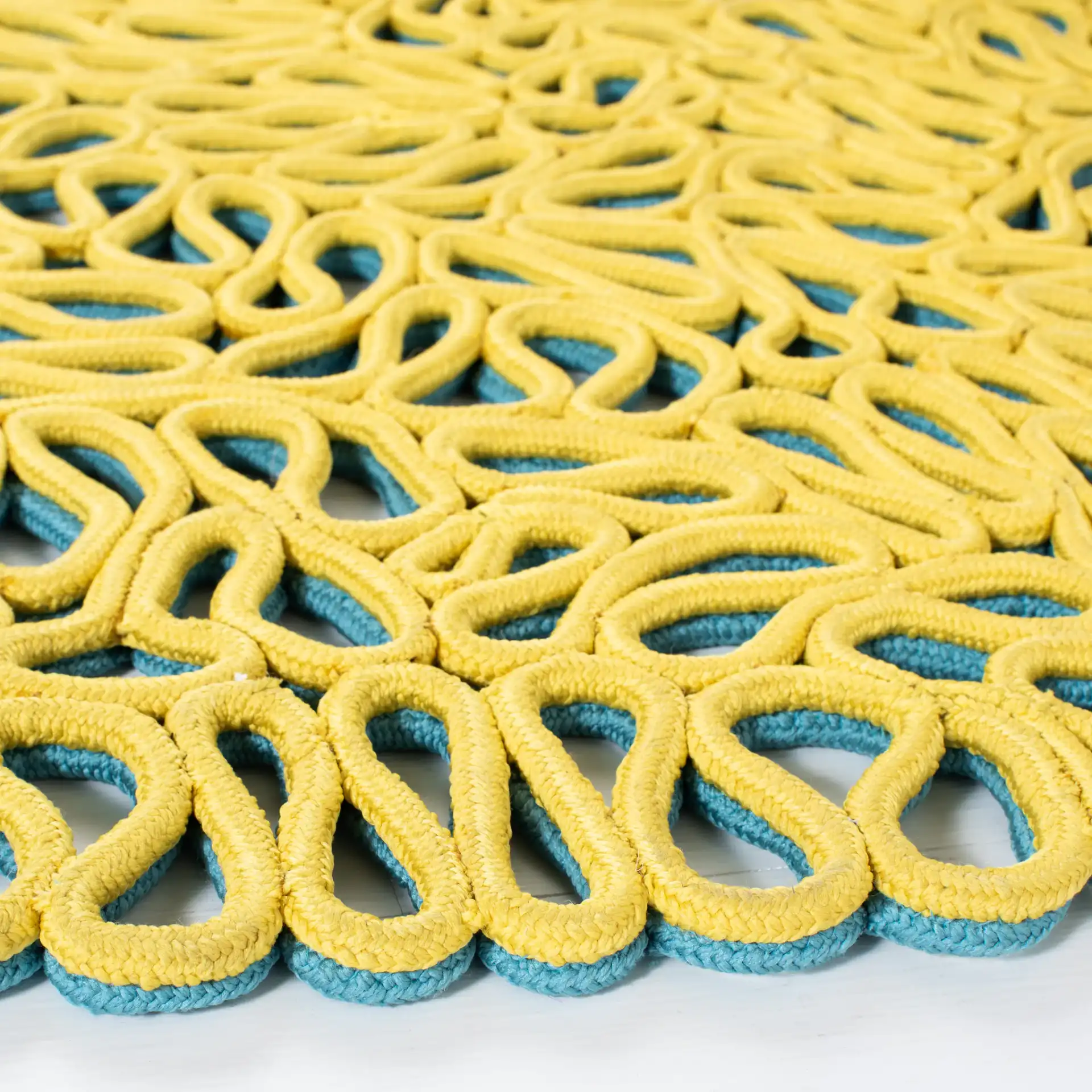 Novelty Interlocking Loop Hand-Knotted Rug in Yellow / Blue in a styled room