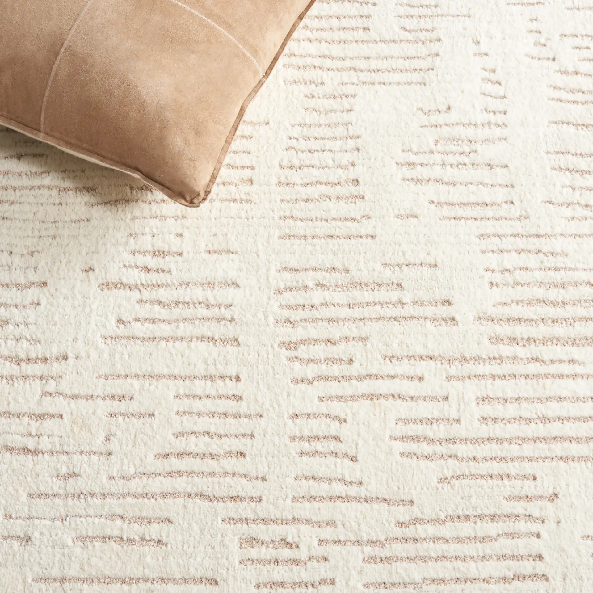 Neptune Dashed Stripe Rug in Ivory / Beige in a styled room