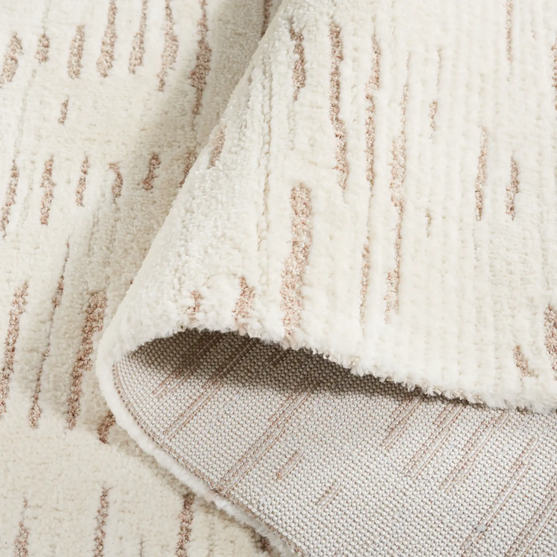 Neptune Dashed Stripe Rug in Ivory / Beige in a styled room