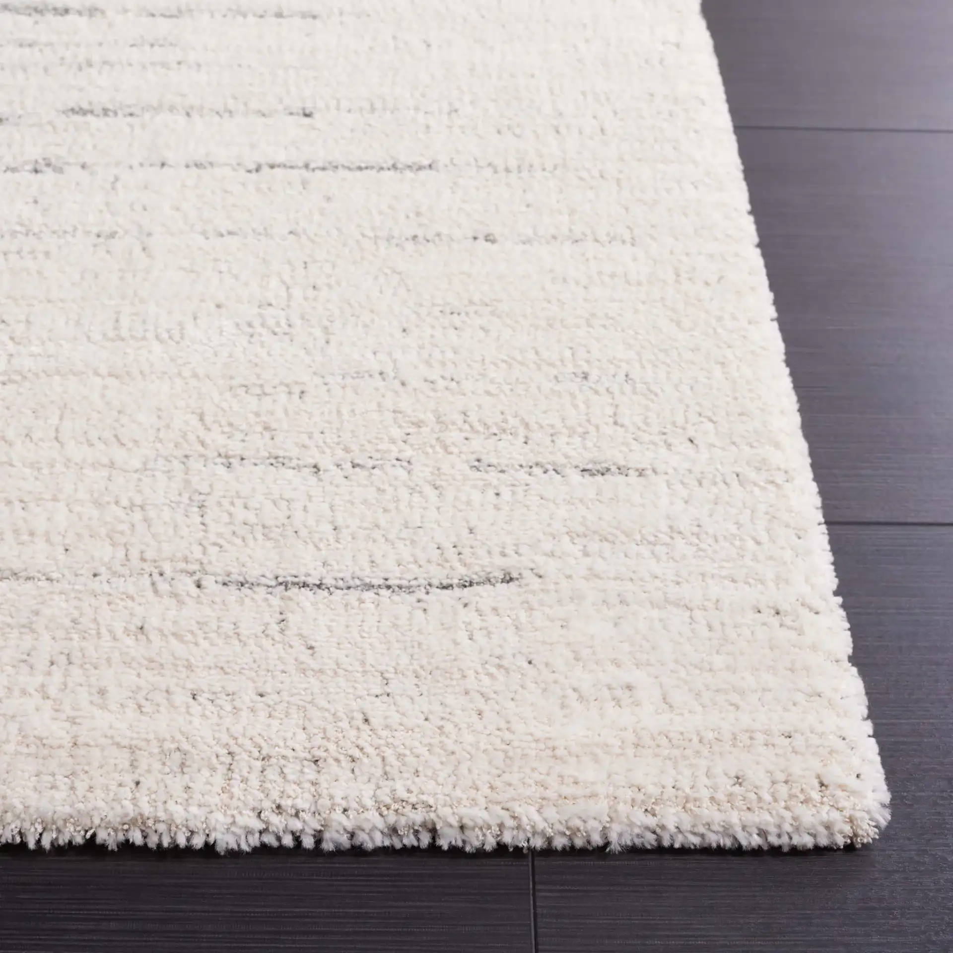 Neptune Broken Stripe Rug in Ivory / Gray in a styled room