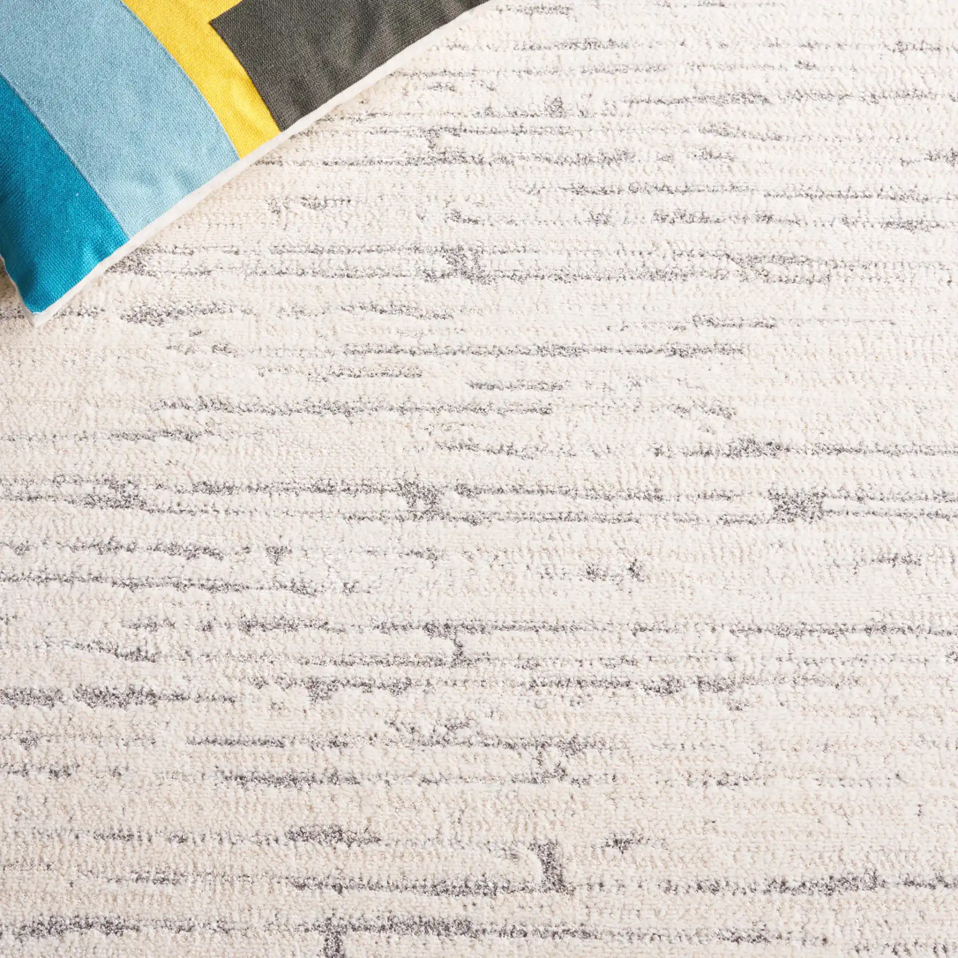 Neptune Broken Stripe Rug in Ivory / Gray in a styled room