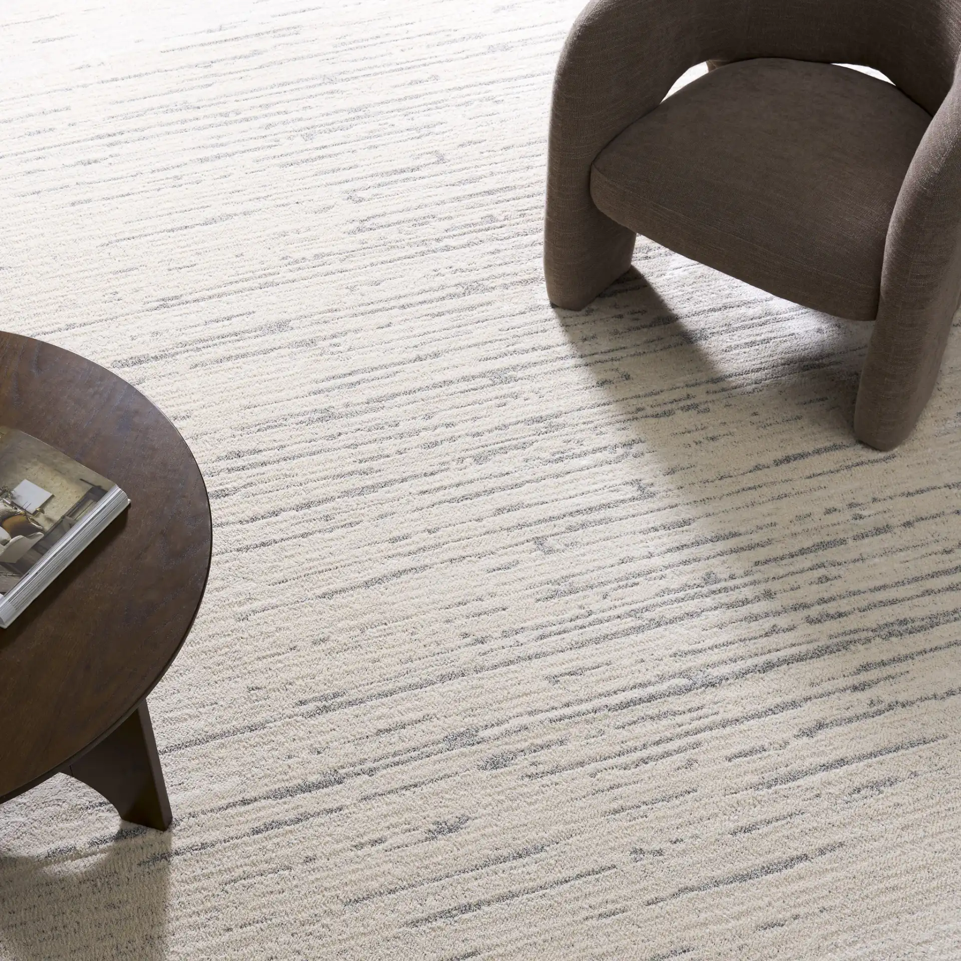 Neptune Broken Stripe Rug in Ivory / Gray in a styled room