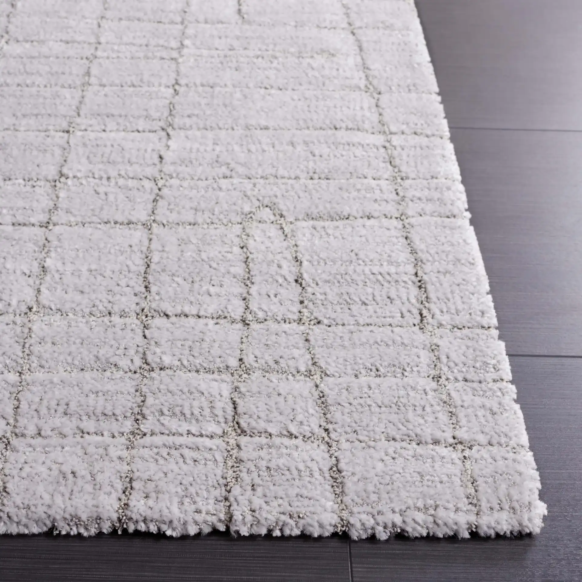Neptune Grid Rug in Light Gray / Gray in a styled room