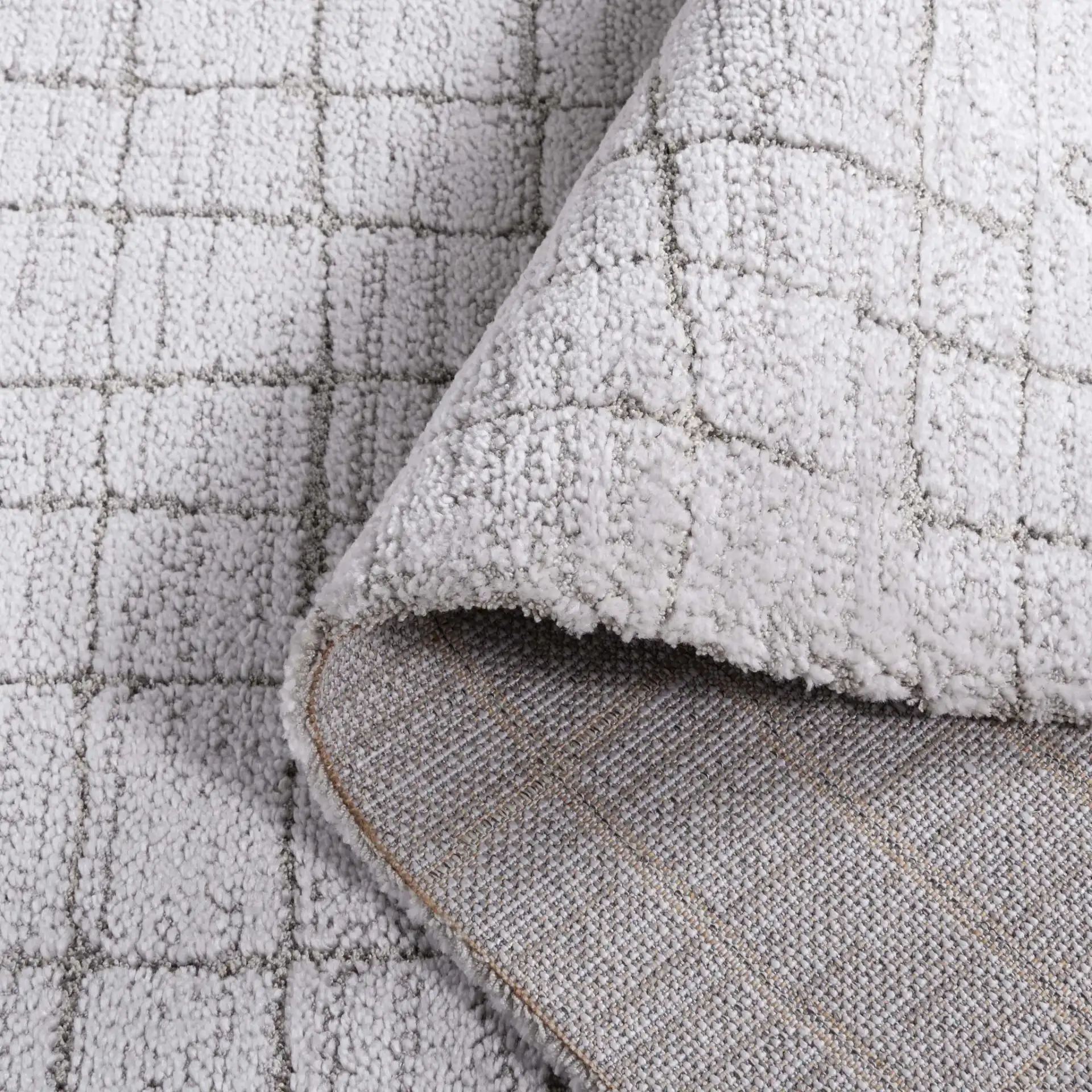 Neptune Grid Rug in Light Gray / Gray in a styled room