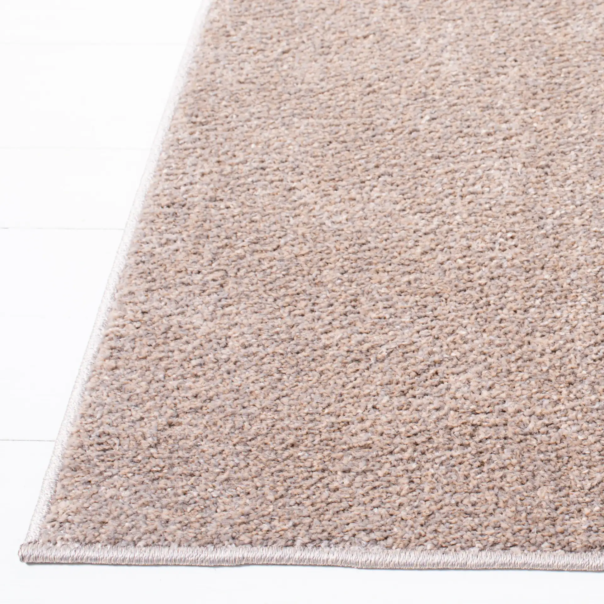 Non-Slip Solid Rug in Taupe in a styled room