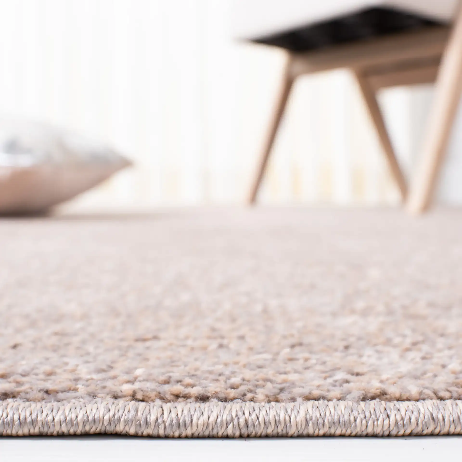 Non-Slip Solid Rug in Taupe in a styled room
