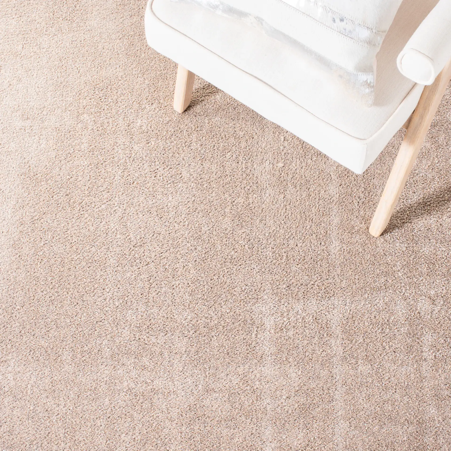 Non-Slip Solid Rug in Taupe in a styled room